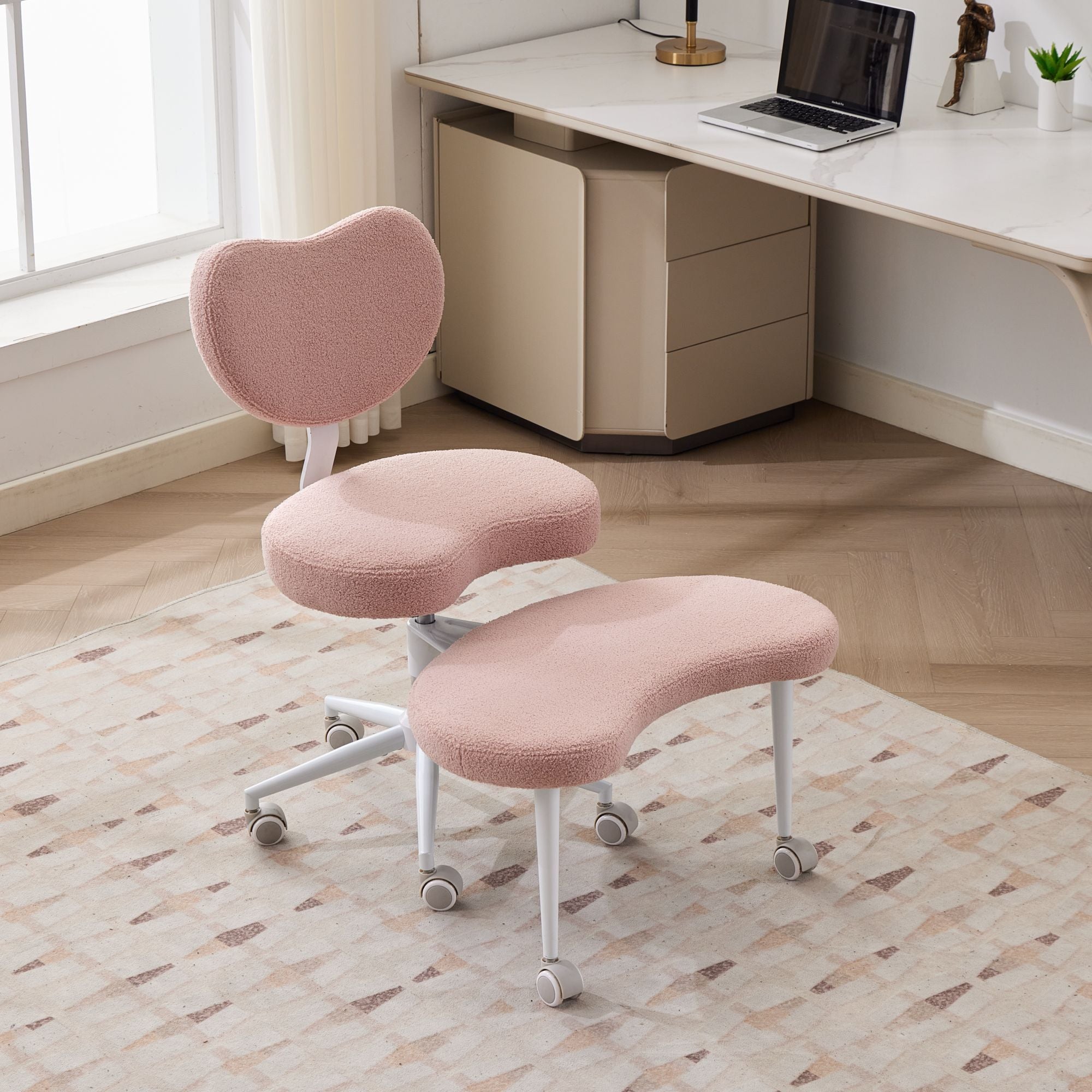 Pink ADHD lumbar-support meditation chair with cross-legged design and wheels in a home office.