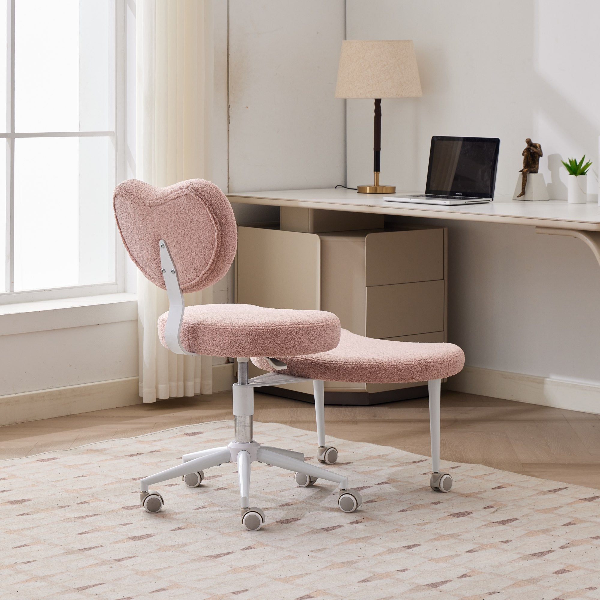 Pink cross-legged chair with wheels and ADHD lumbar support, ideal for meditation and work.