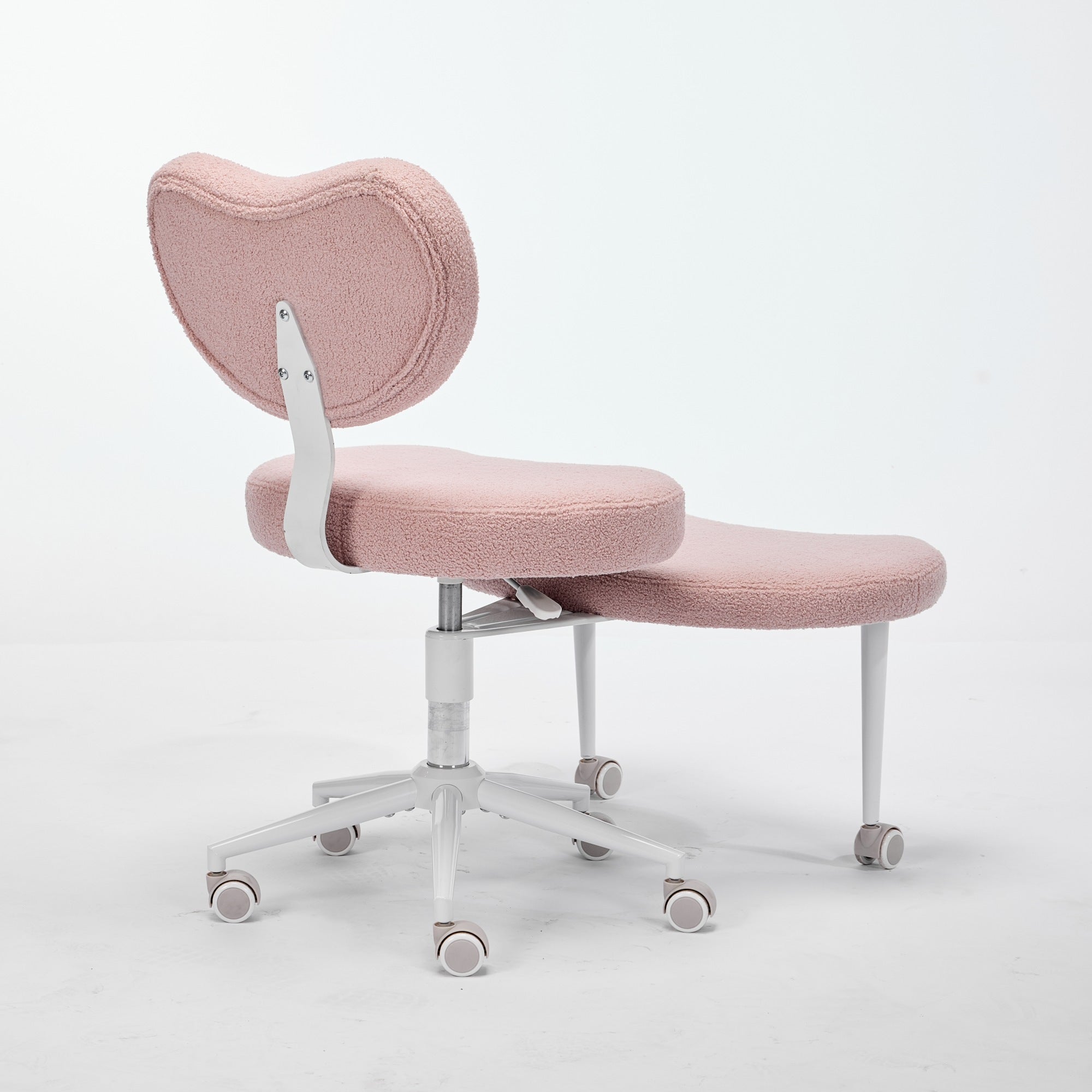 Pink cross-legged meditation chair with wheels, heart-shaped backrest, and lumbar support.