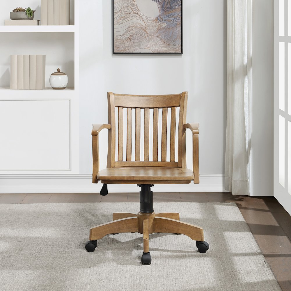 Deluxe Wood Banker's Chair in medium oak with pneumatic height adjustment, locking tilt, and dual-wheel casters.