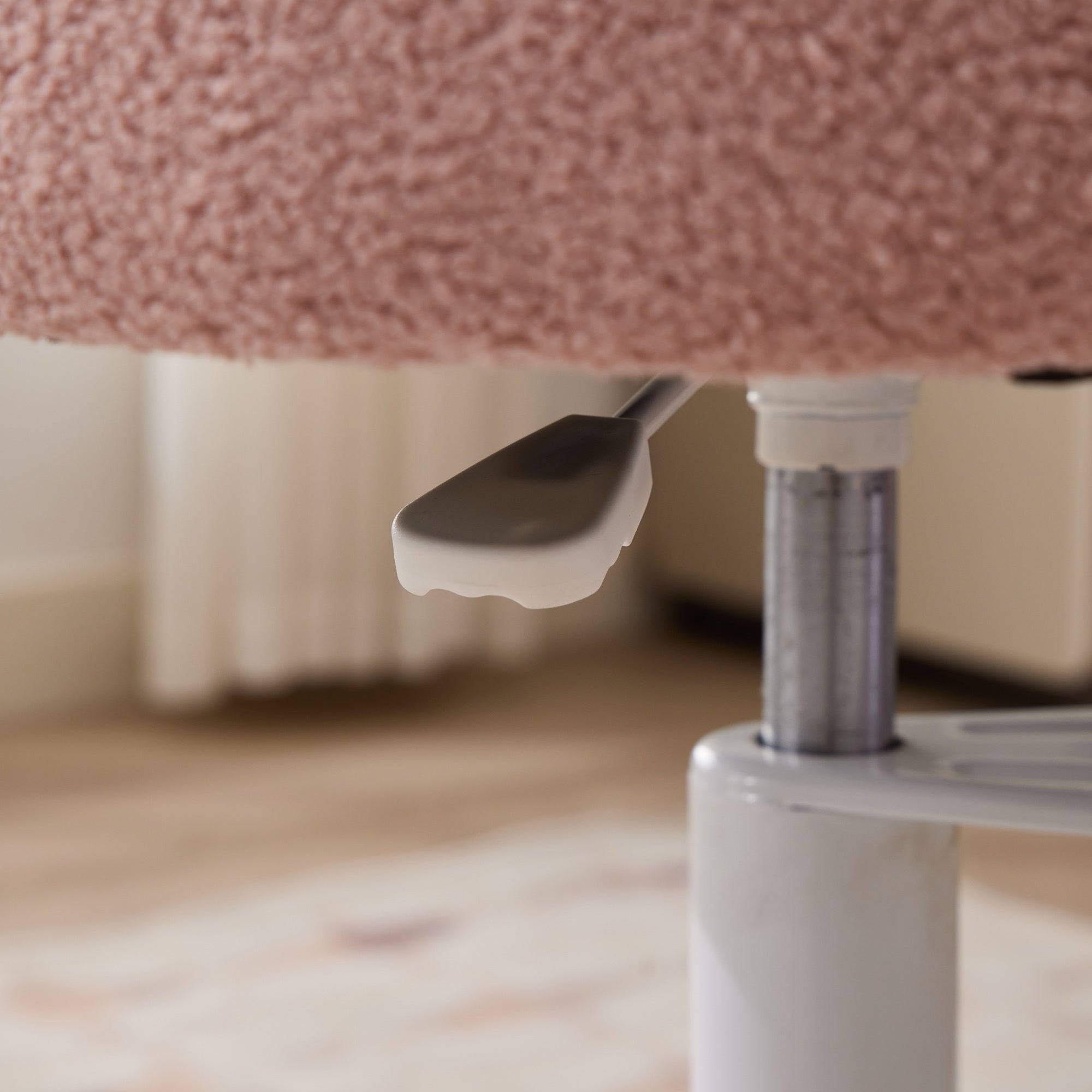 Under-seat lever on pink ADHD lumbar-support meditation chair.