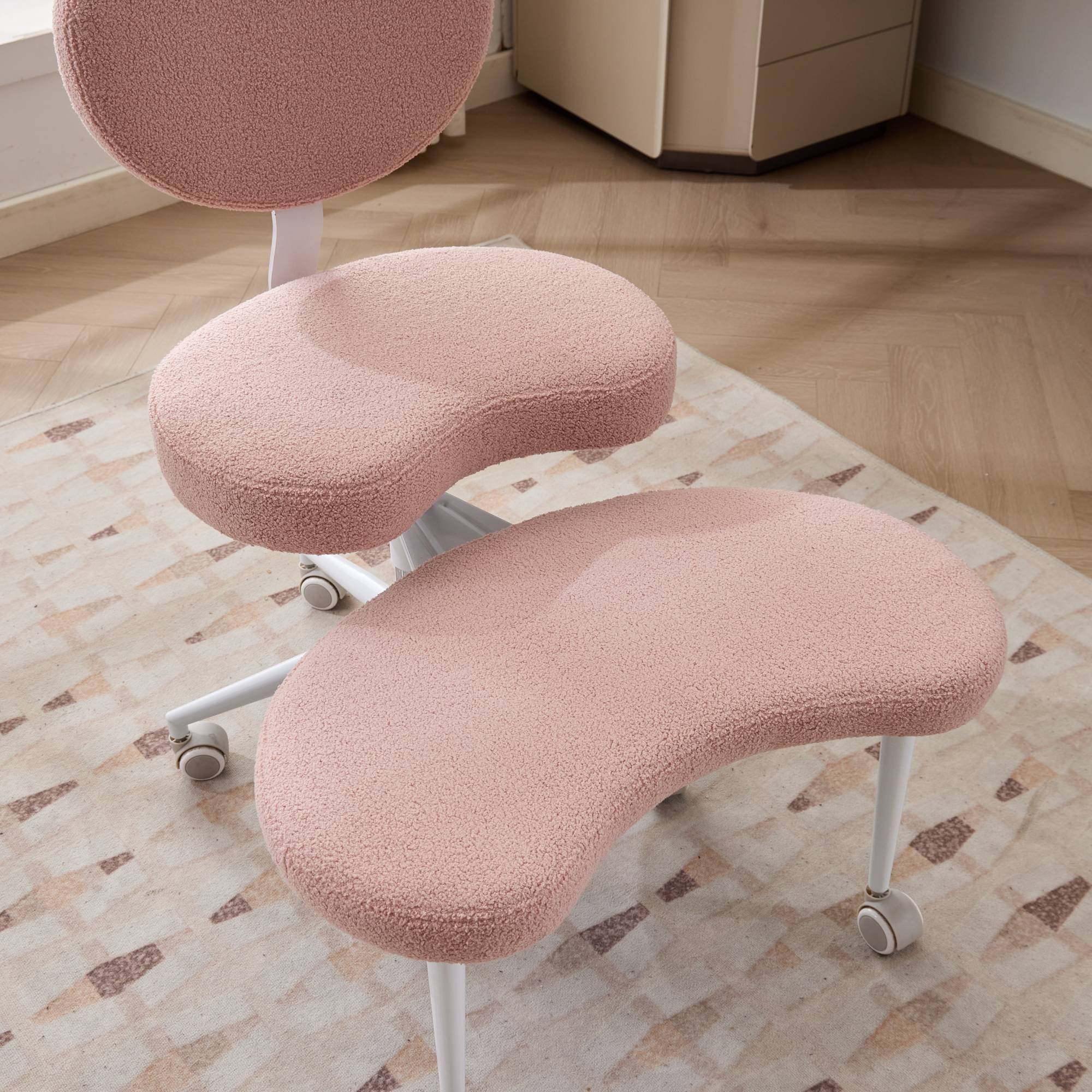 Pink ADHD lumbar-support cross-legged meditation chair with wheels for focus and study.