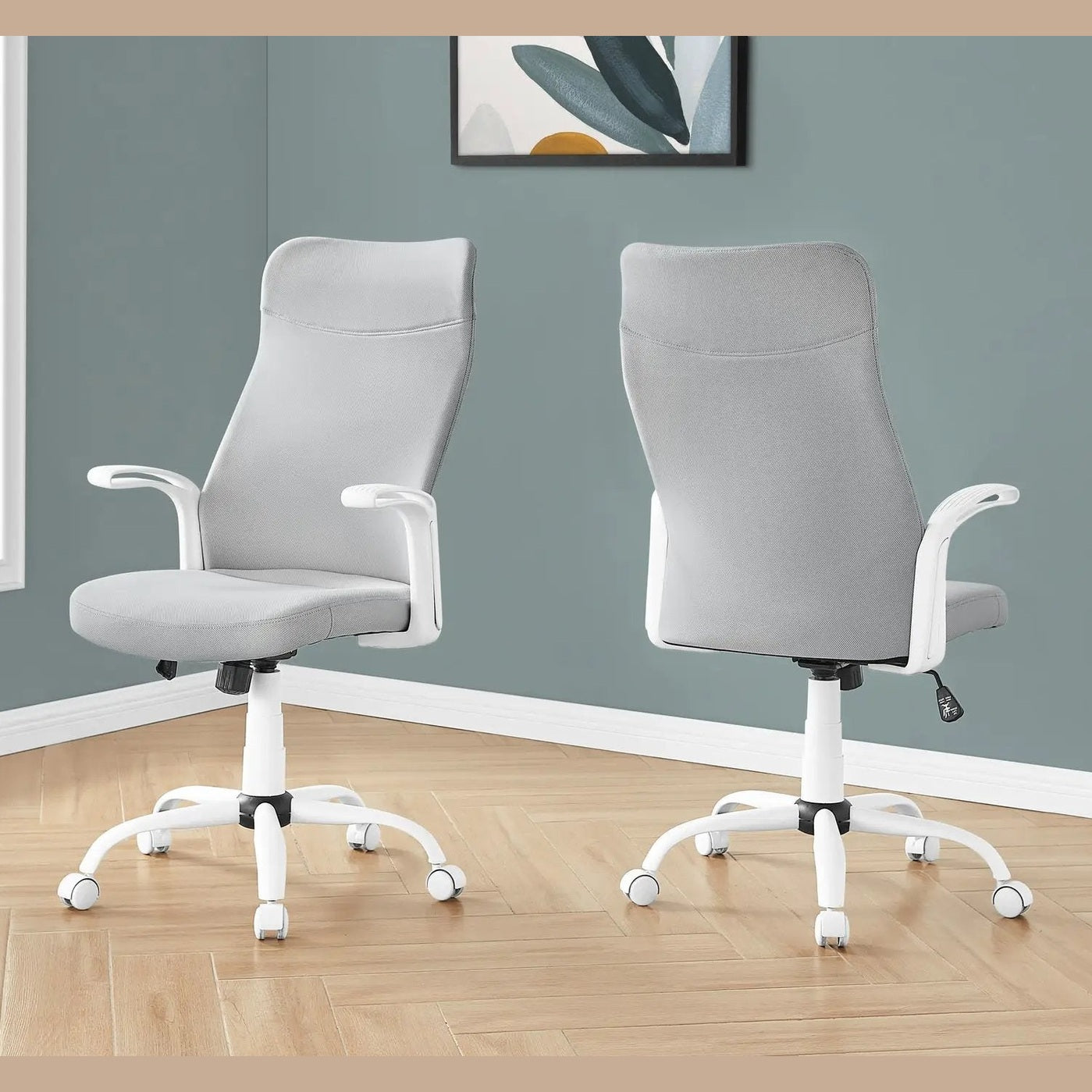 Office chairs pair with grey mesh backs and white metal bases, ergonomic swivel seating.