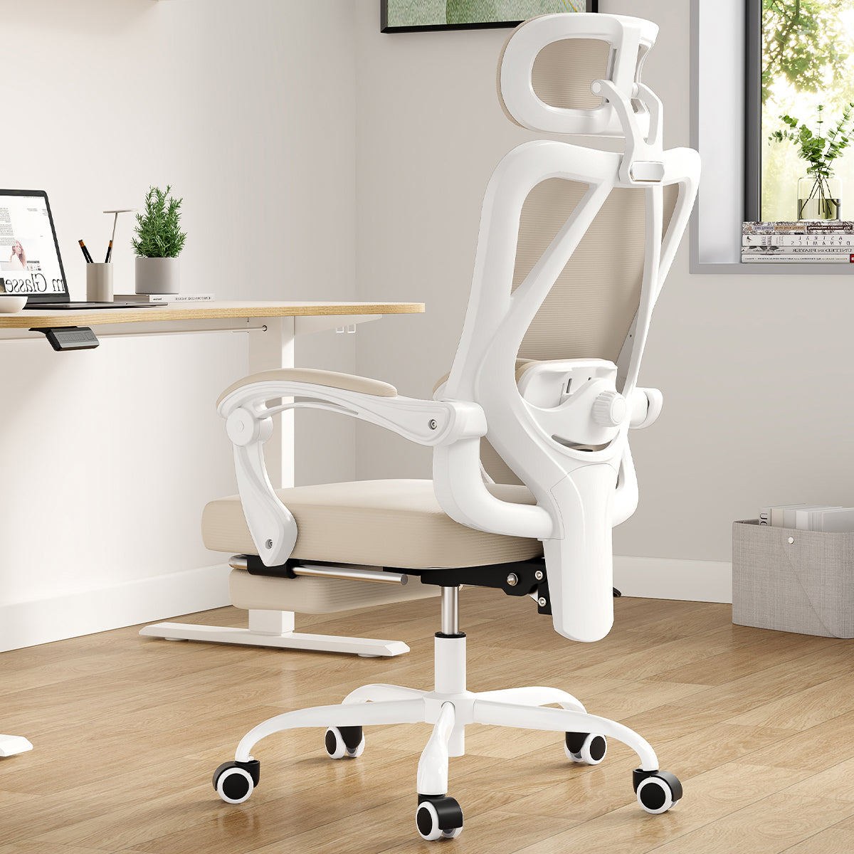 White ergonomic office chair with mesh back, headrest, footrest, and adjustable lumbar support for home office use.