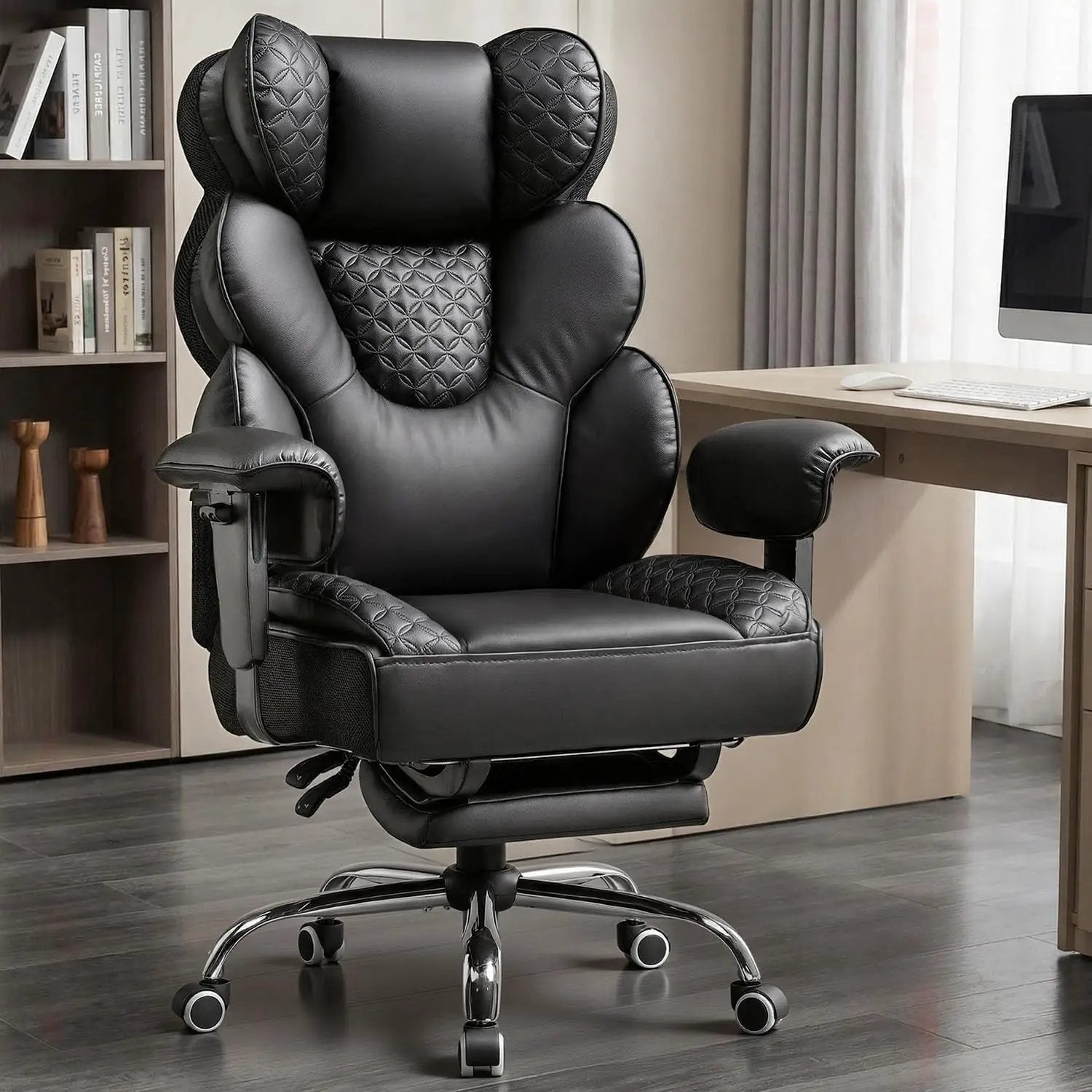 Black big and tall office chair by ADS with high back, ergonomic design, sturdy frame, and footrest for comfortable workspace support.