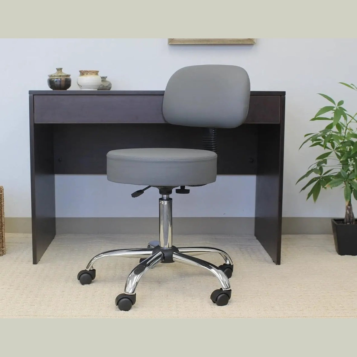 Grey ADS ergonomic drafting stool with back support, adjustable gas lift, swivel base, and rolling casters for office comfort.