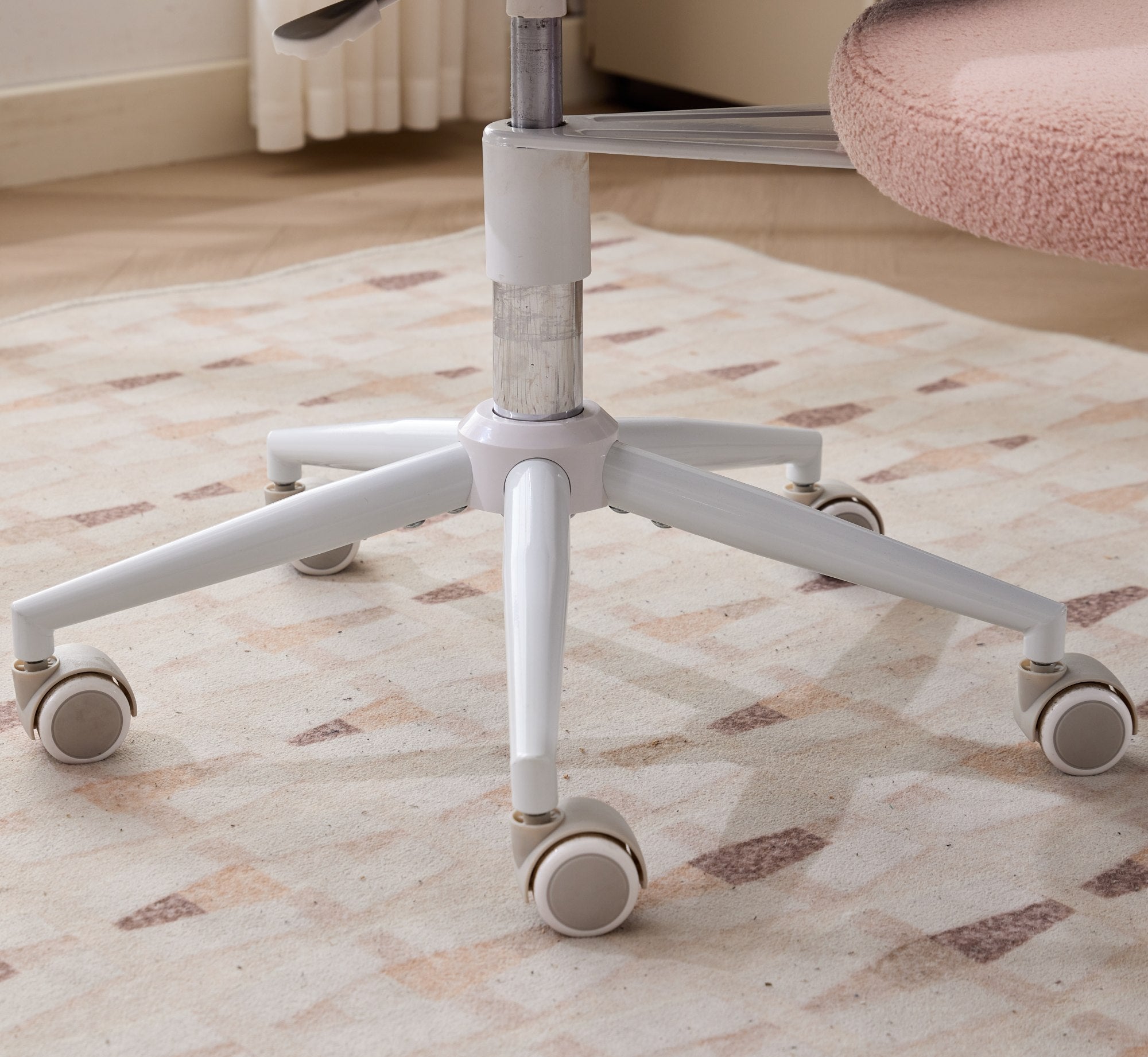 Pink ADHD lumbar-support meditation chair with cross-legged design on a five-wheel base.