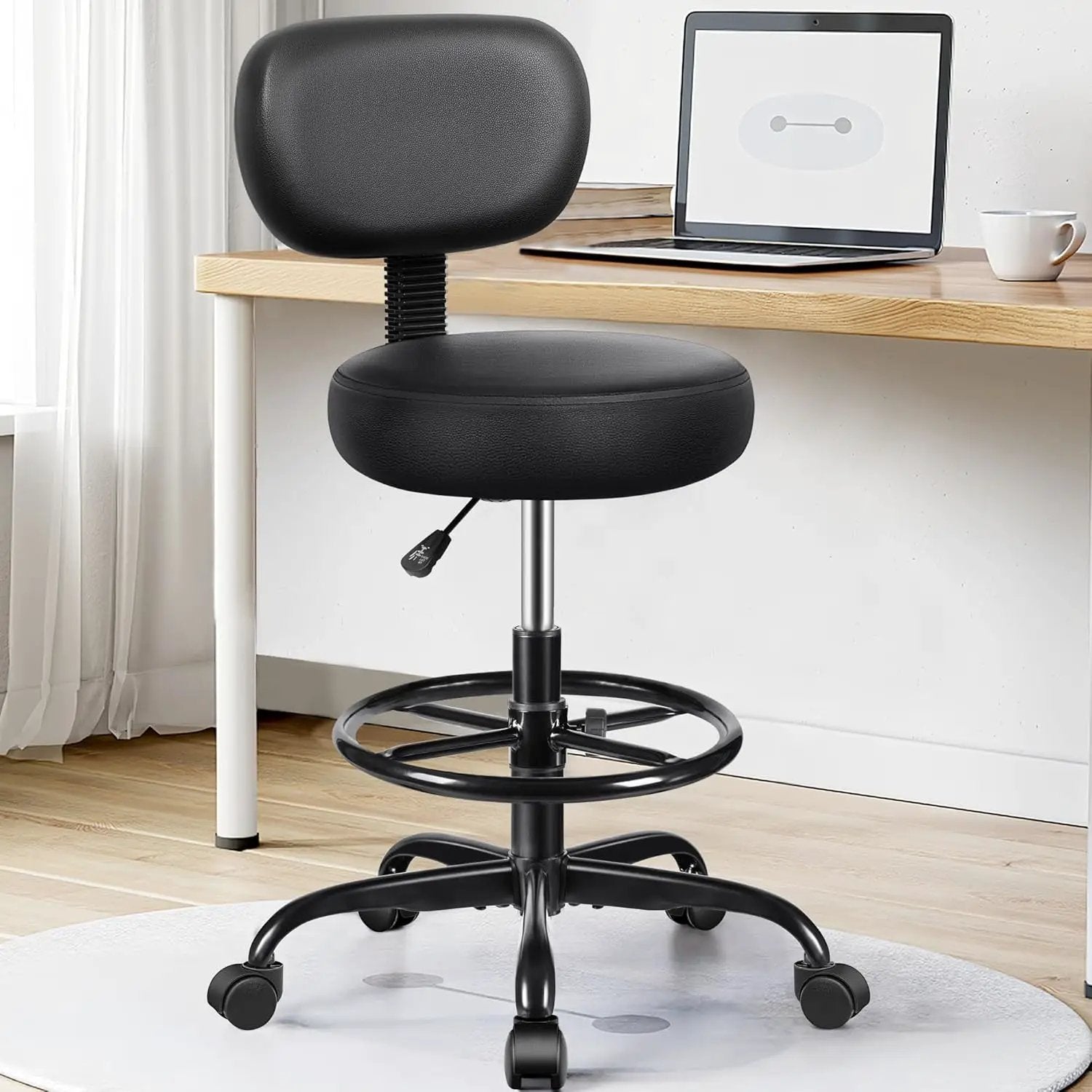 Black ergonomic adjustable PU leather swivel drafting chair with backrest and rolling footrest for standing desks by Brick Attic