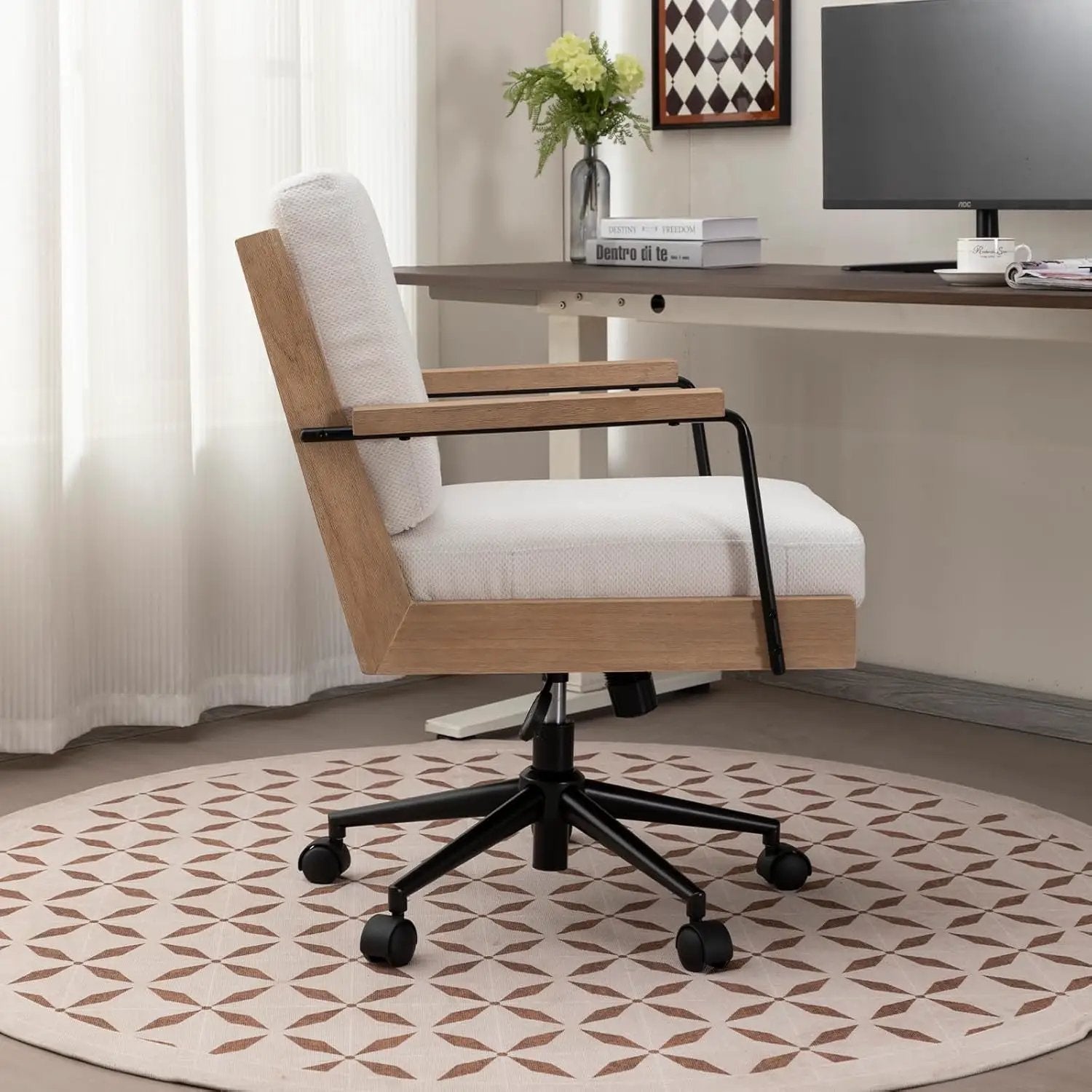 Wood office chair with white fabric upholstery, armrests, and rolling casters
