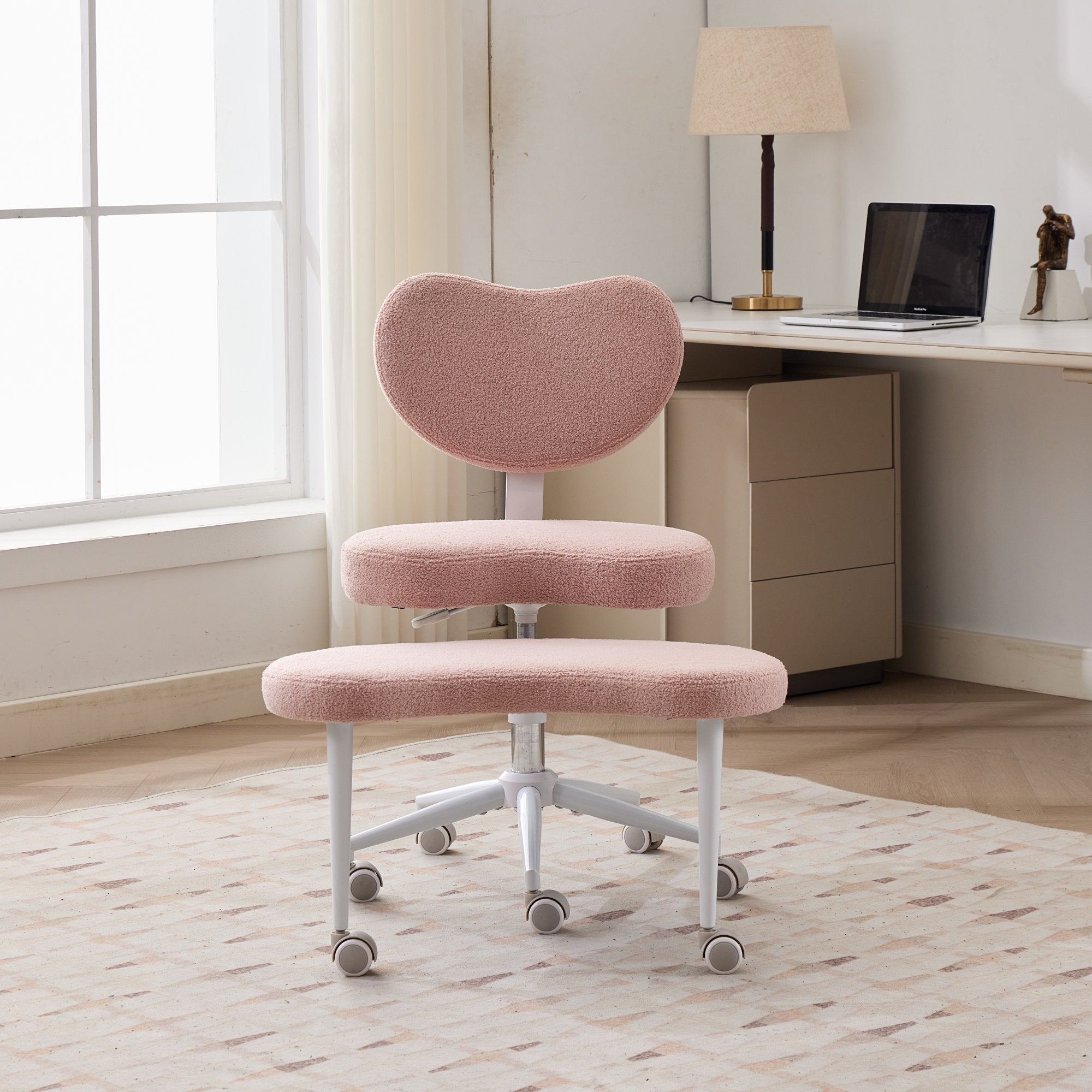 Pink ADHD lumbar-support meditation chair on wheels in a bright home office.