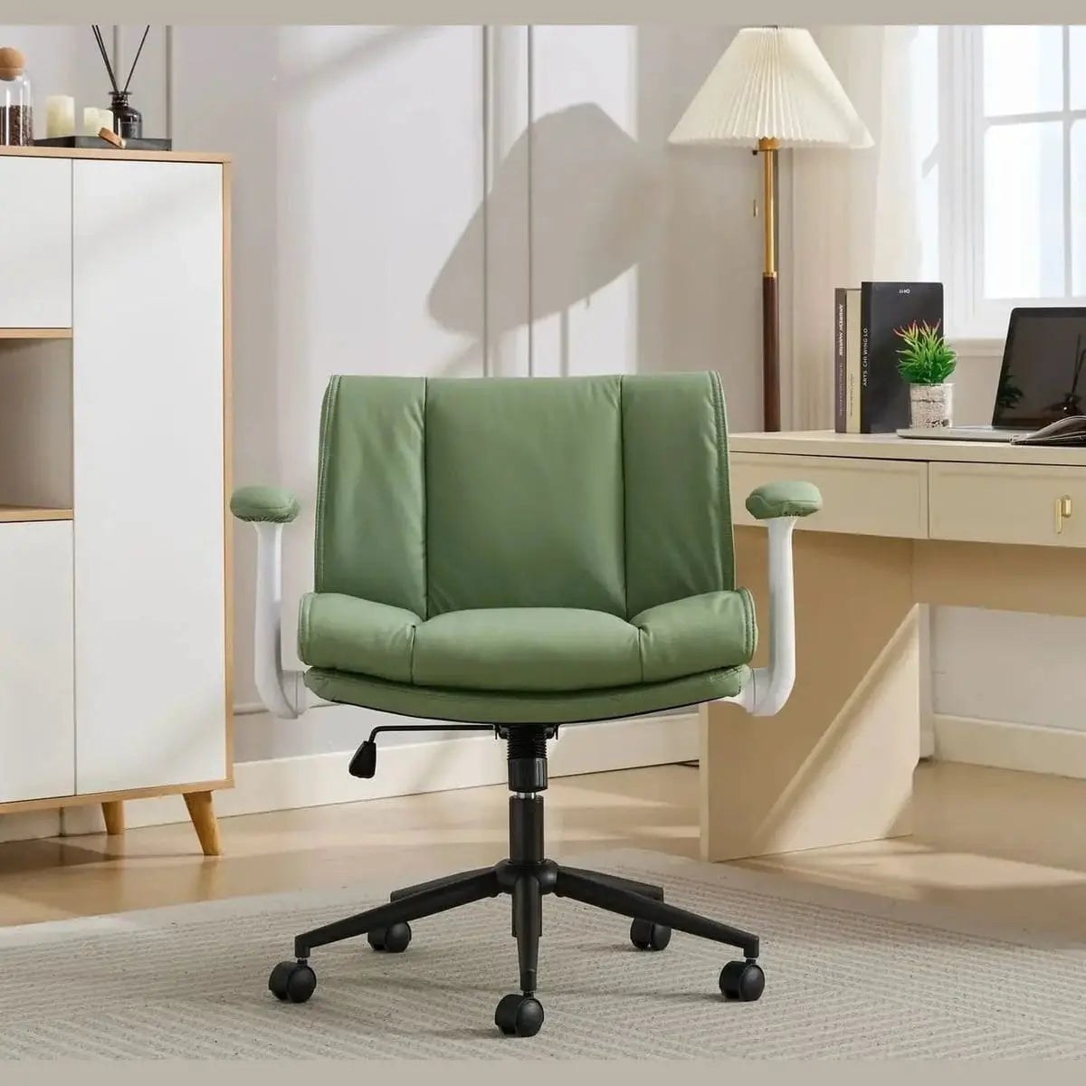 Doba ergonomic black leather crisscross office chair with flip-up armrests, wheels, and adjustable features.
