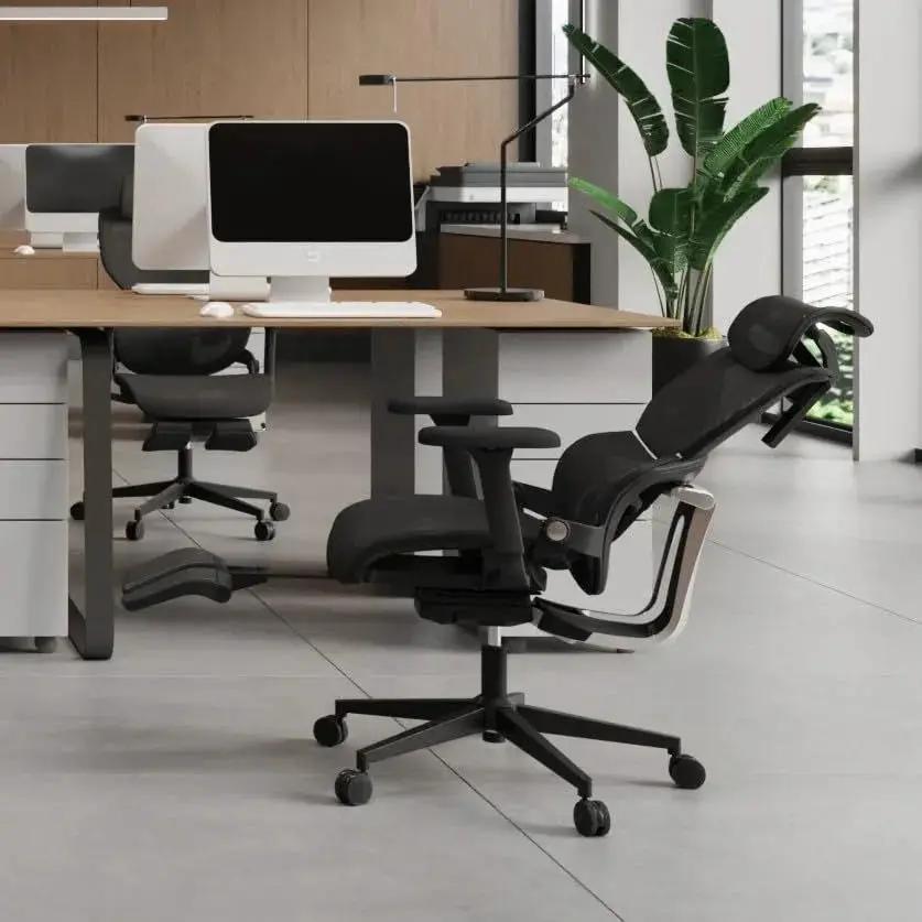 Doba Ultimate Comfort 3D ergonomic office chair with headrest, retractable footrest, and dynamic lumbar support in black metal mesh.