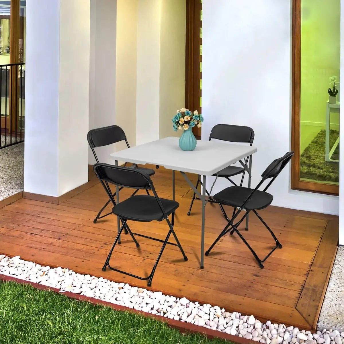 Black Doba Plasti heavy-duty folding chair with 350 lb capacity, weatherproof and durable for outdoor or indoor use.