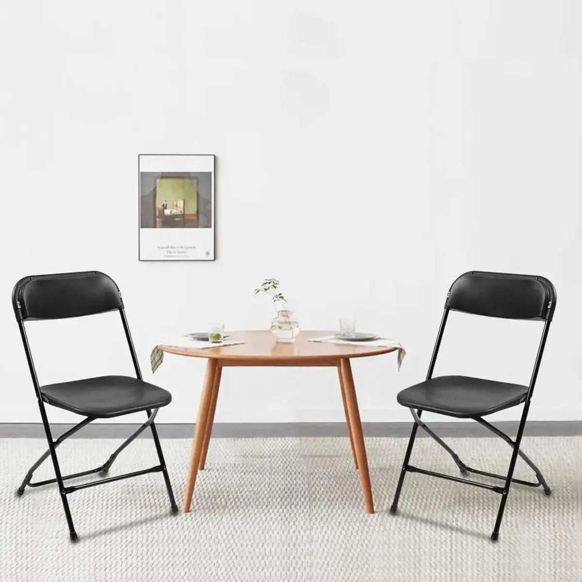 Black Doba Plasti heavy-duty folding chair with 350 lb capacity, weatherproof and durable for outdoor seating.