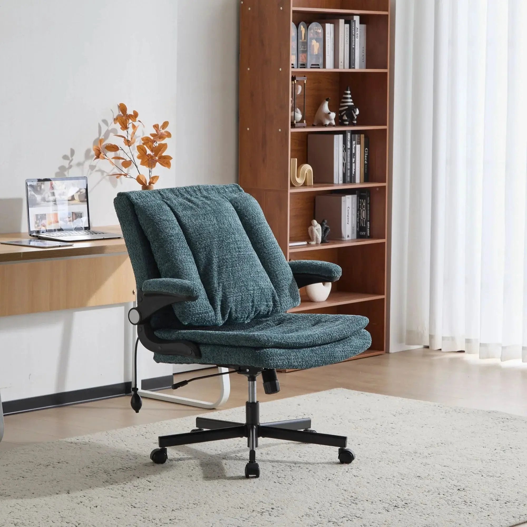 Dark green Doba ergonomic office chair with criss-cross design, airbag lumbar support, 25-inch wide seat, and adjustable flip-up armrests.