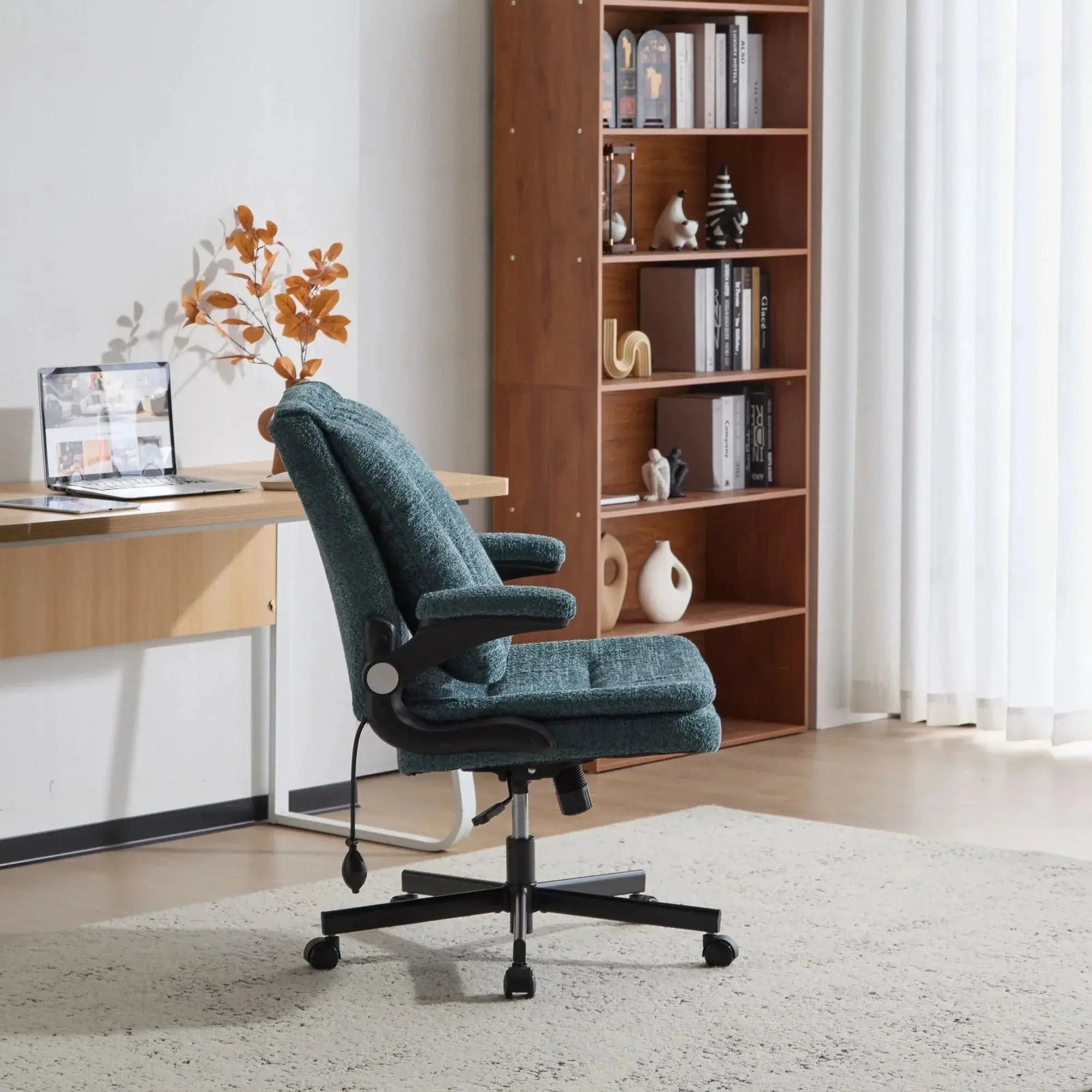 Dark green Doba ergonomic office chair with criss-cross design, airbag lumbar support, 25-inch seat, and adjustable flip-up armrests.