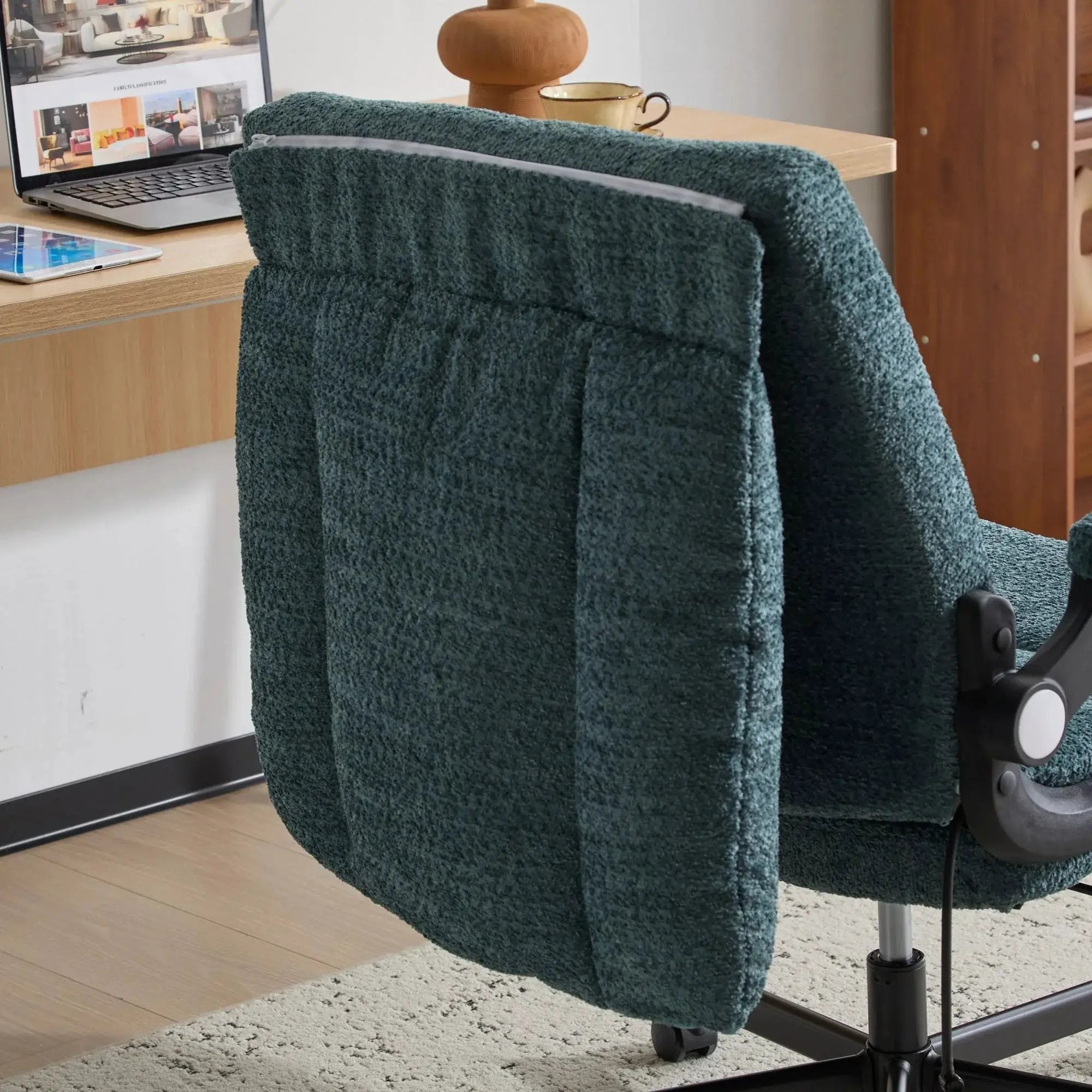 Dark green Doba ergonomic office chair with criss-cross design, airbag lumbar support, 25-inch seat, and adjustable flip-up armrests.