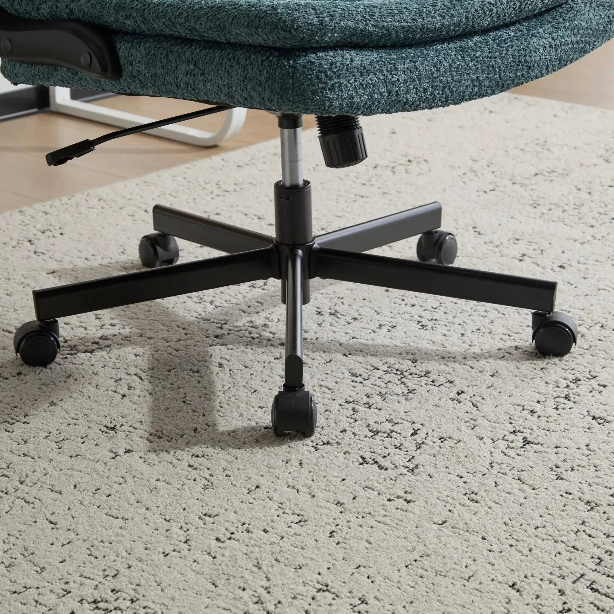 Dark green Doba ergonomic criss cross office chair with airbag lumbar support, extra-wide 25-inch seat, and adjustable flip-up armrests.