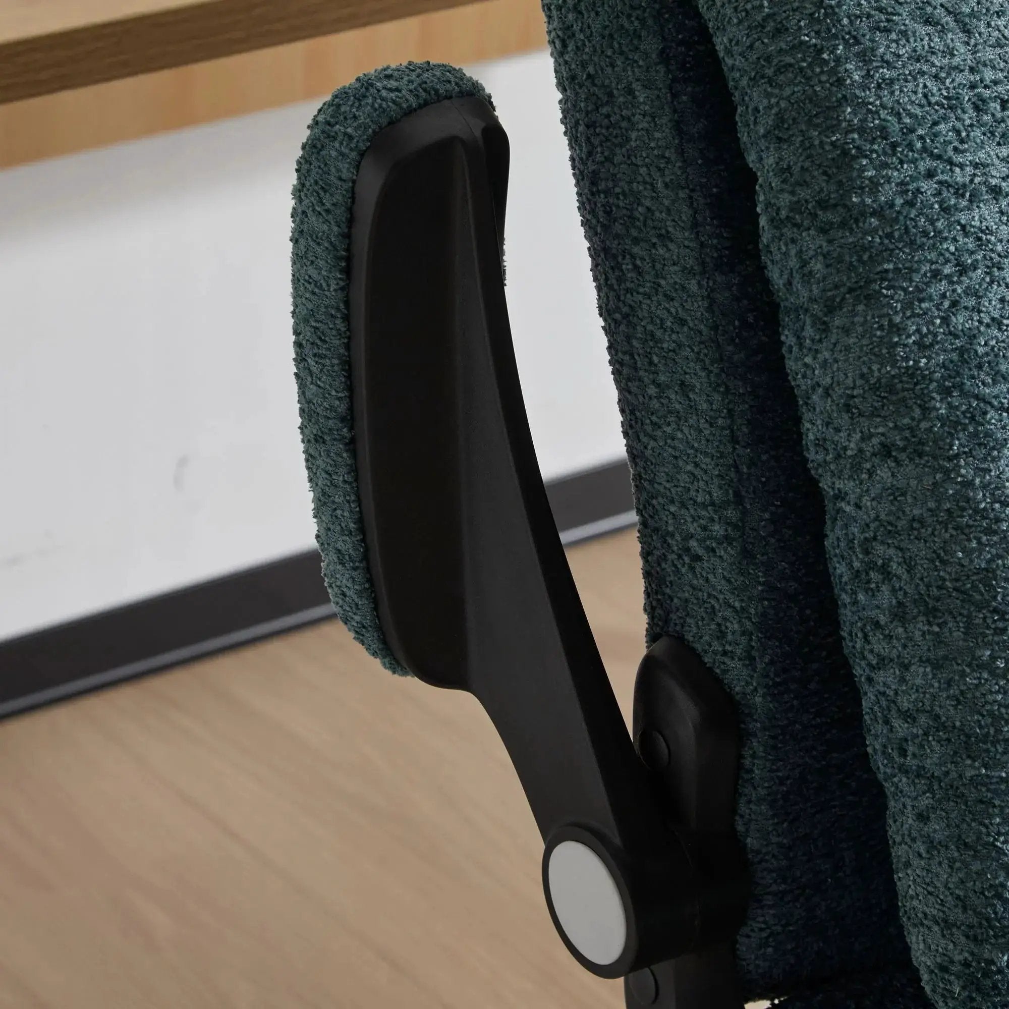 Dark green Doba ergonomic office chair with criss-cross design, airbag lumbar support, 25-inch seat, and adjustable flip-up armrests.