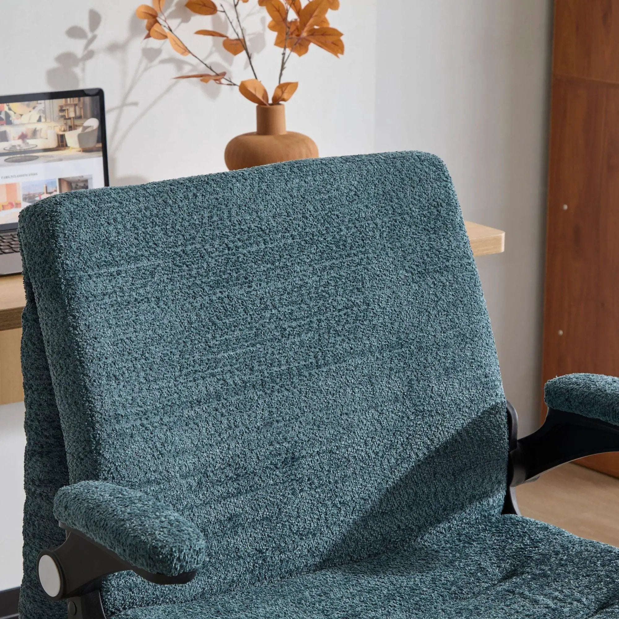 Doba dark green ergonomic office chair with criss-cross design, airbag lumbar support, 25-inch seat, and adjustable flip-up armrests.