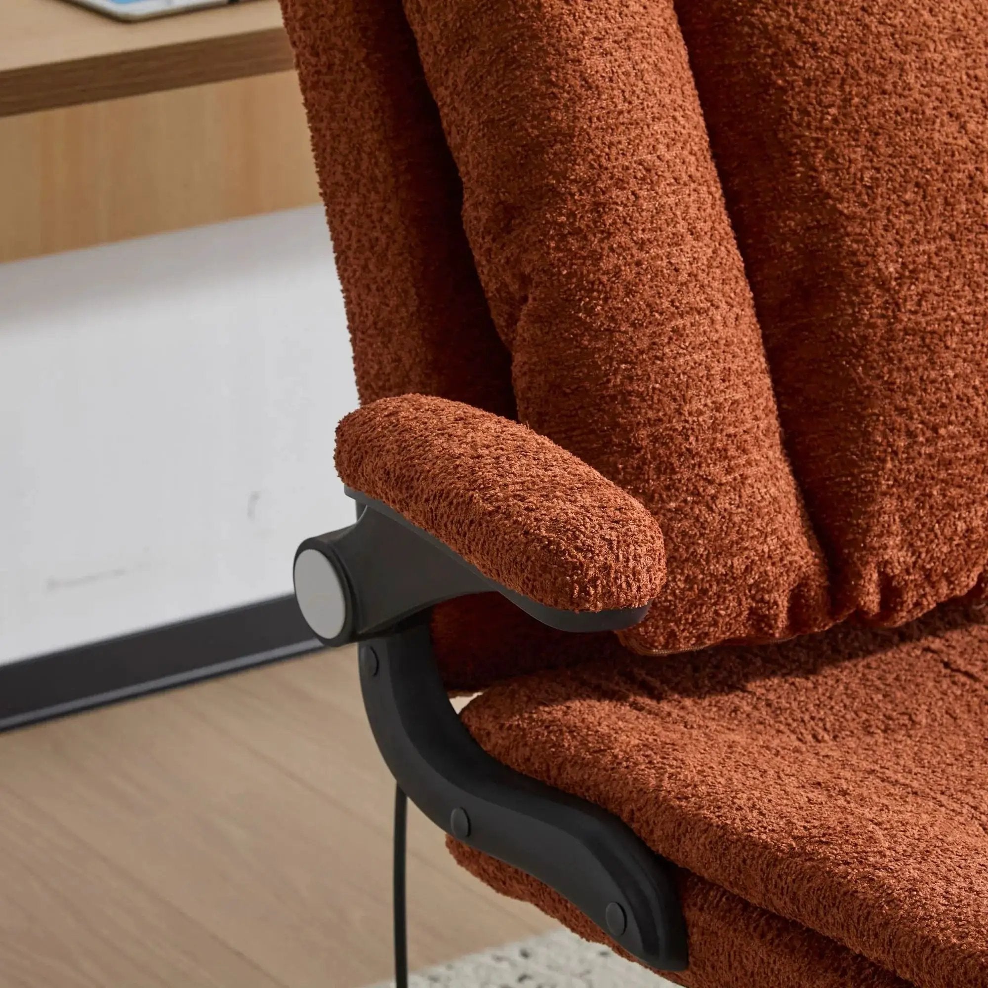 Orange Doba ergonomic criss-cross desk chair with flip-up back and arms, featuring nylon upholstery and adjustable support.
