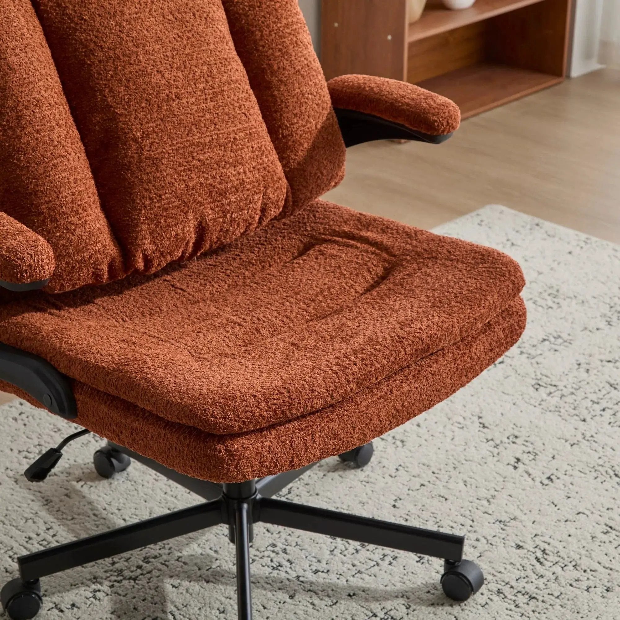 Doba premium ergonomic criss-cross desk chair with orange nylon upholstery, flip-up back, and adjustable armrests.