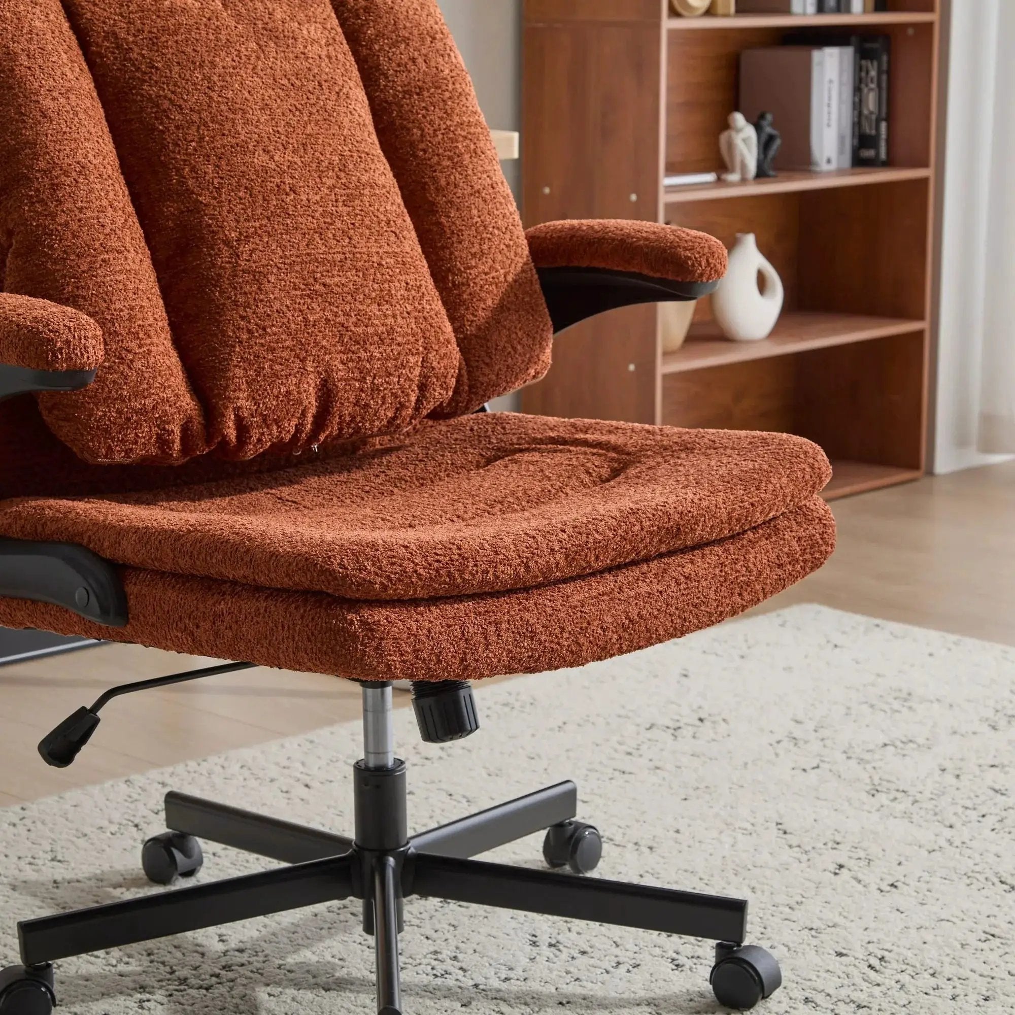 Doba orange premium ergonomic criss cross desk chair with flip-up back and armrests, featuring nylon upholstery and adjustable design.