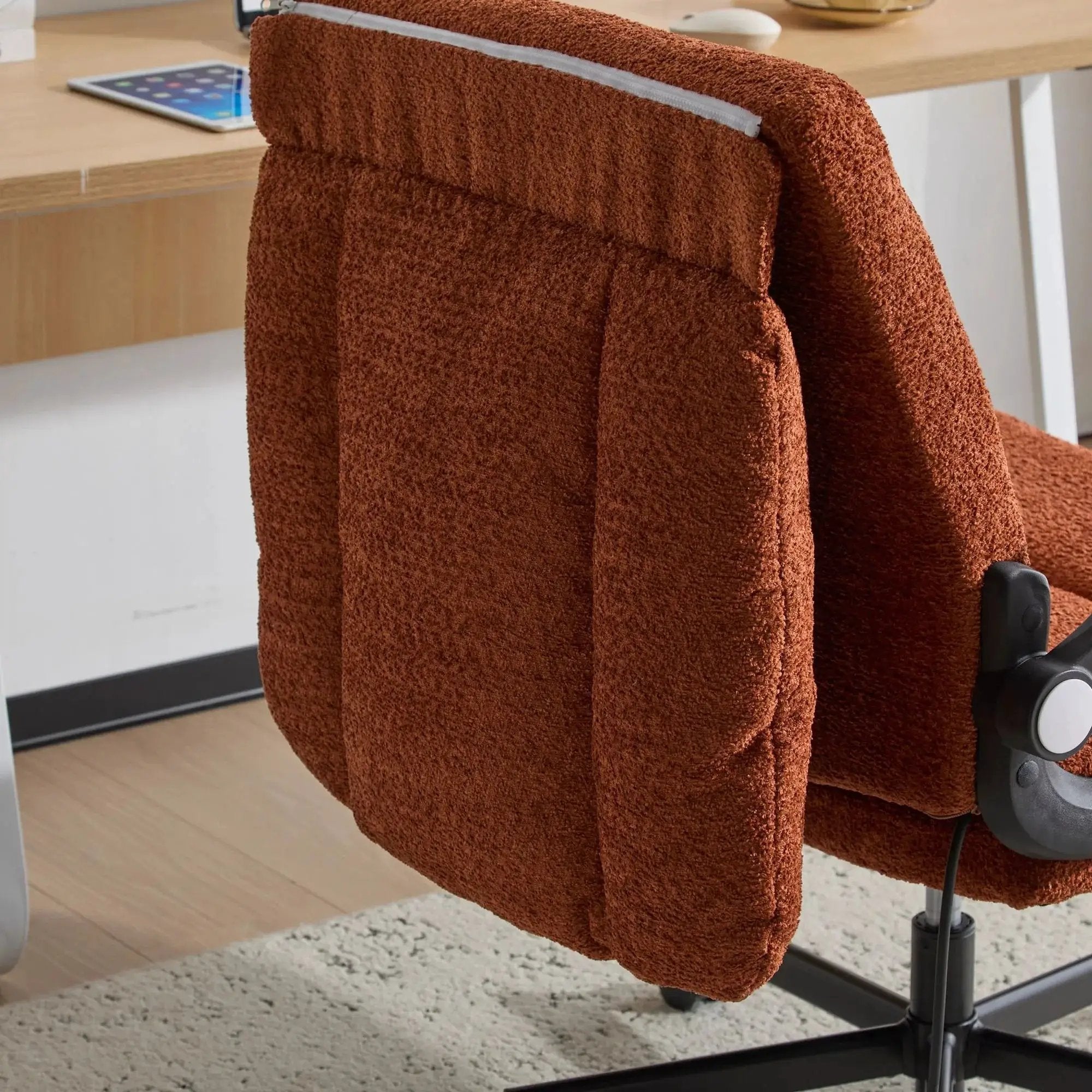 Orange Doba ergonomic criss-cross desk chair with flip-up back and arms, featuring nylon upholstery and adjustable support.
