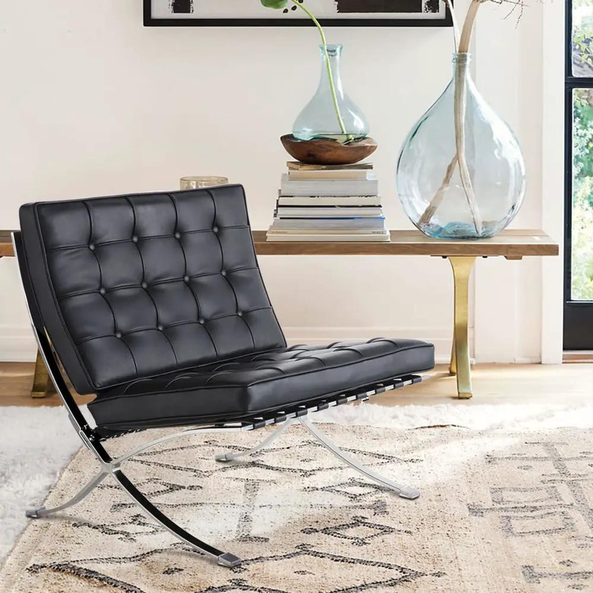 Black foldable lounge chair in Barcelona style with durable frame and non-slip feet, designed for comfortable space-saving seating.