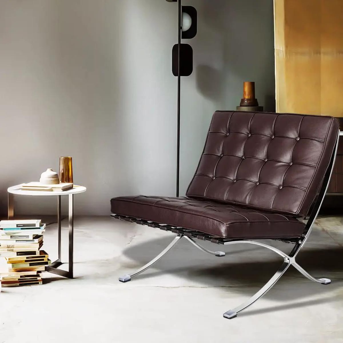 Black foldable lounge chair in Barcelona style with durable construction and non-slip feet, ideal for modern relaxation spaces.