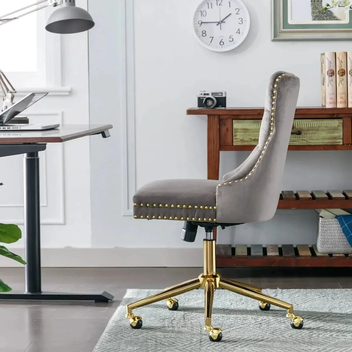 Gray velvet tufted executive office chair with ergonomic foam padding and gold metal base by Platinum-Level Office Chairs.