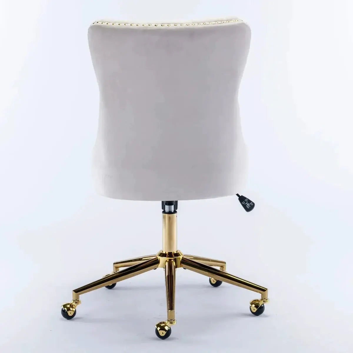 Luxurious beige velvet tufted office chair with gold metal base and swivel function, designed for executive workspace comfort.