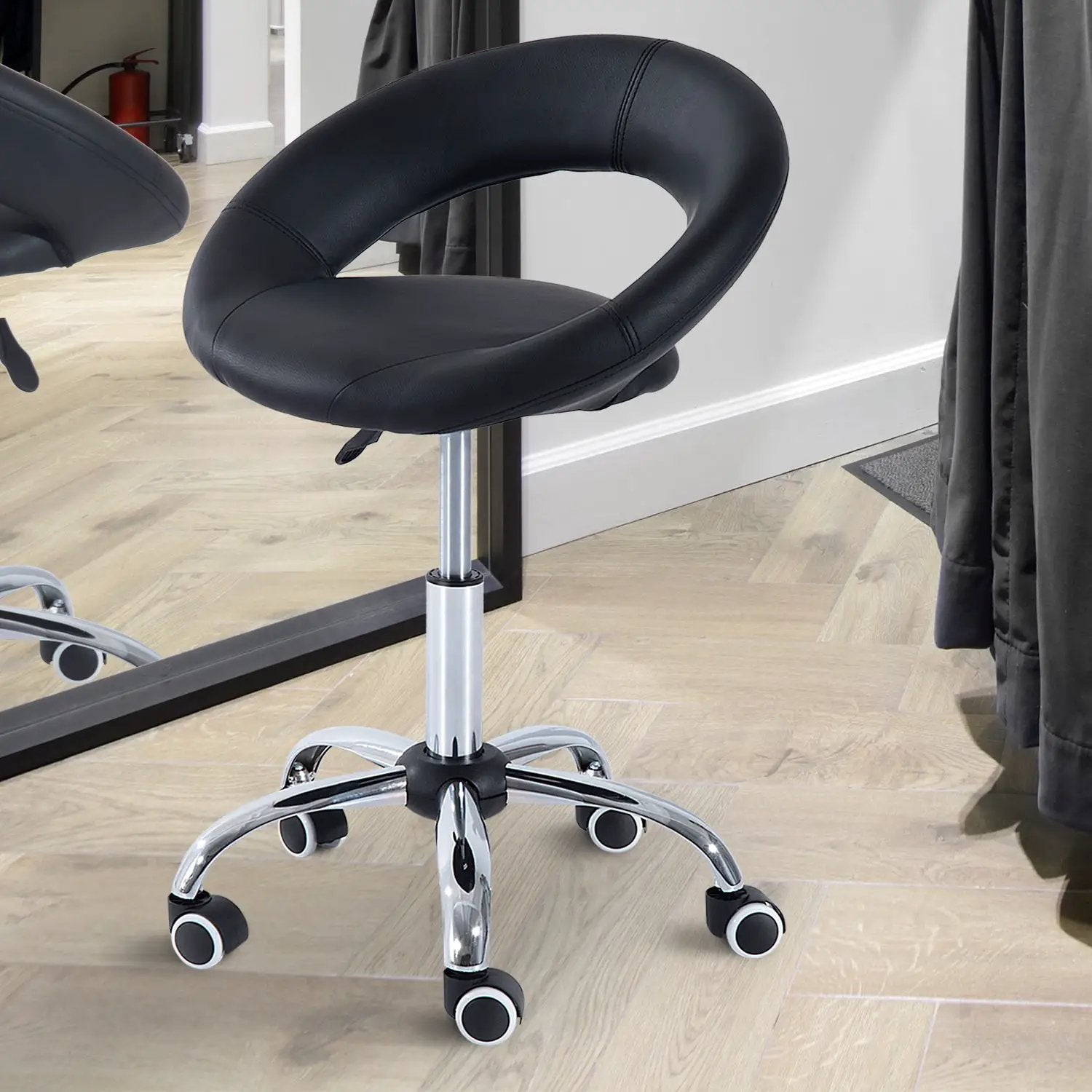Black adjustable height rolling salon office stool with open back, faux leather seat, swivel design, and casters by Platinum-Level Office Chairs.