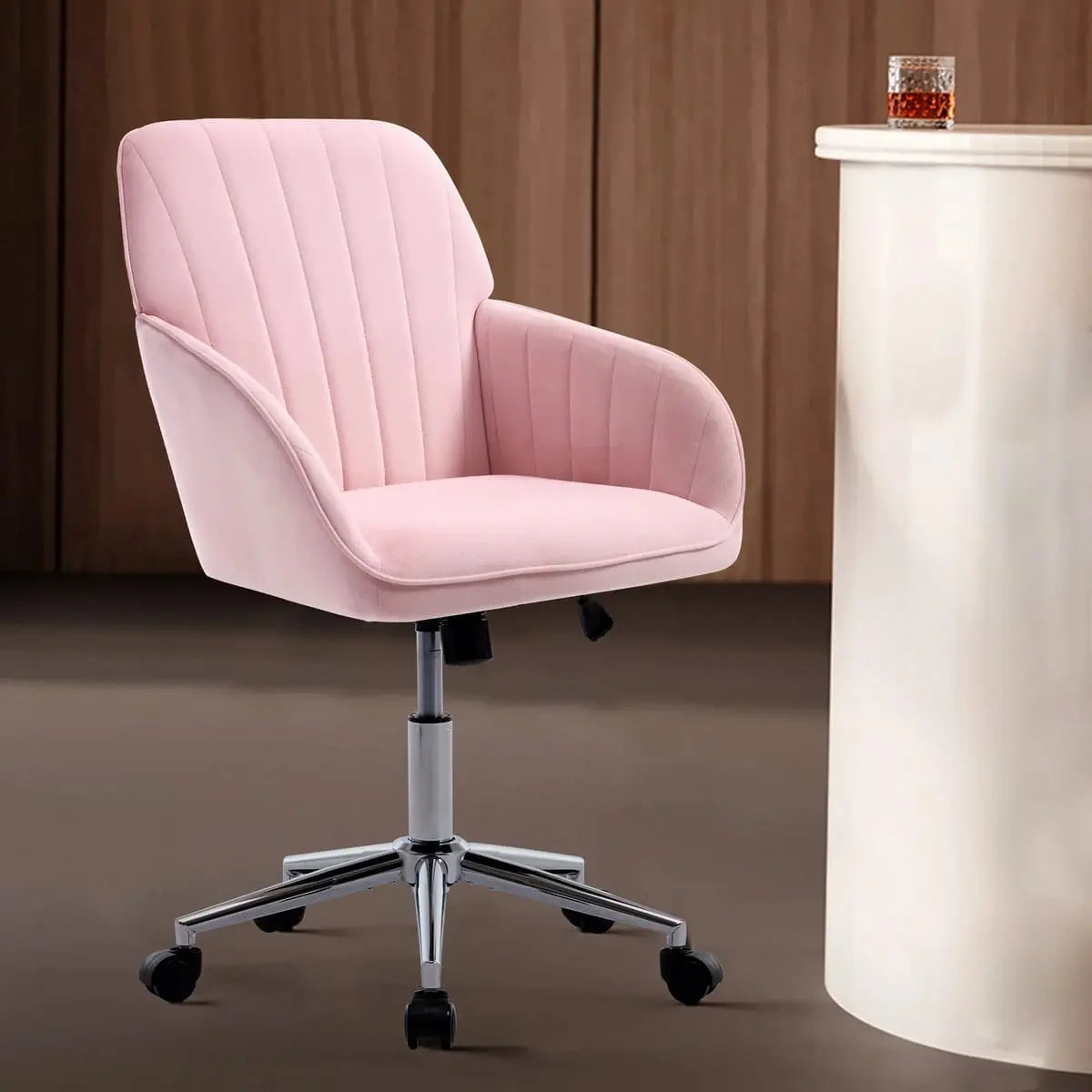 Baby pink velvet ergonomic swivel office chair with adjustable height, lumbar support, and memory foam cushion from Platinum-Level Office Chairs.