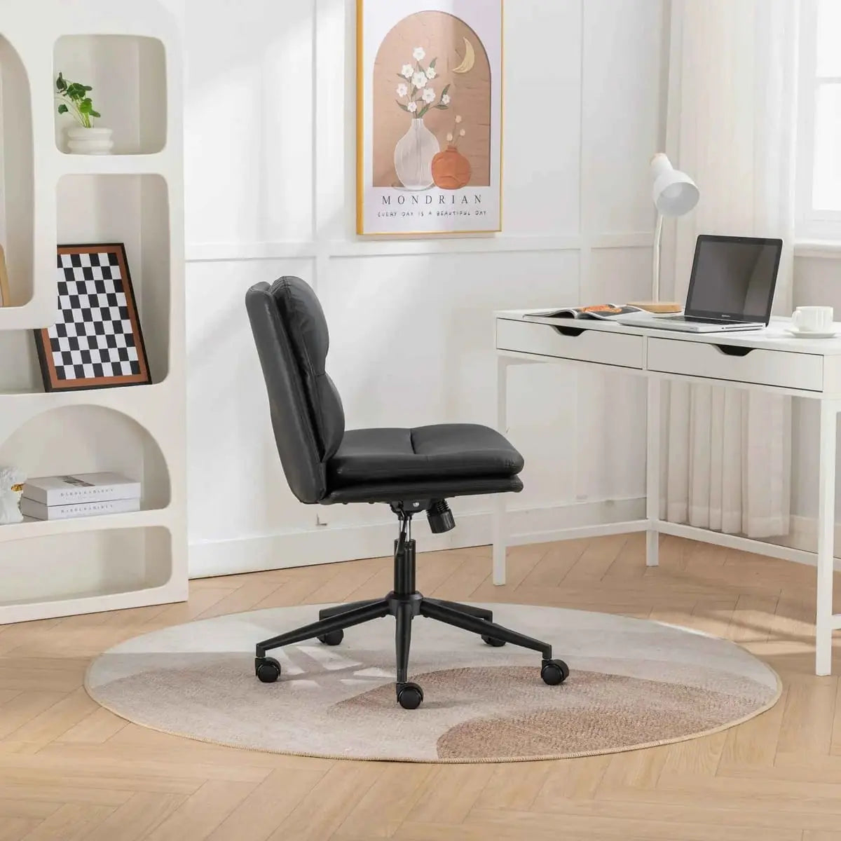 Black Bizerte adjustable swivel chair with wide ergonomic seat and criss-cross design by Platinum-Level Office Chairs.
