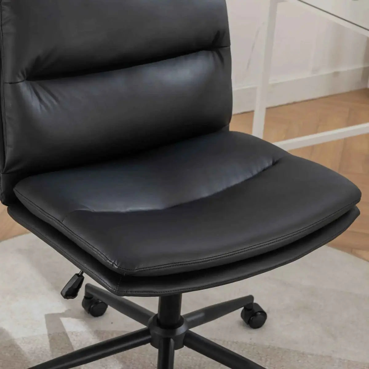 Black Bizerte adjustable swivel chair with wide ergonomic seat and criss-cross design, by Platinum-Level Office Chairs.