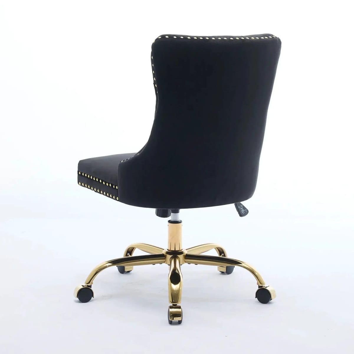 Luxurious black velvet tufted office chair with gold electroplated base, deep seating, ergonomic design, and nailhead trim.