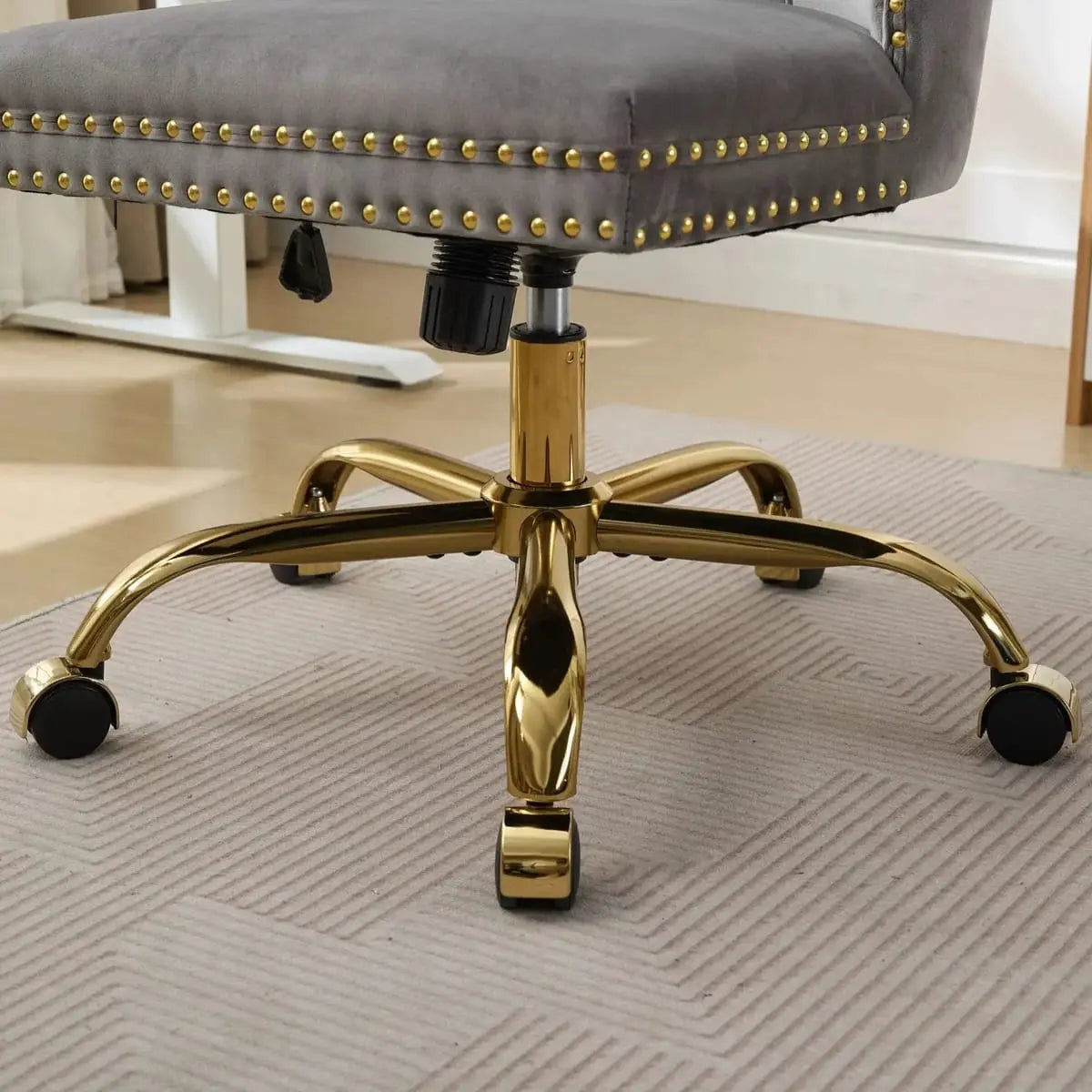 Luxurious gray velvet tufted office chair with gold base, adjustable swivel, and wide deep seating from Platinum-Level Office Chairs.