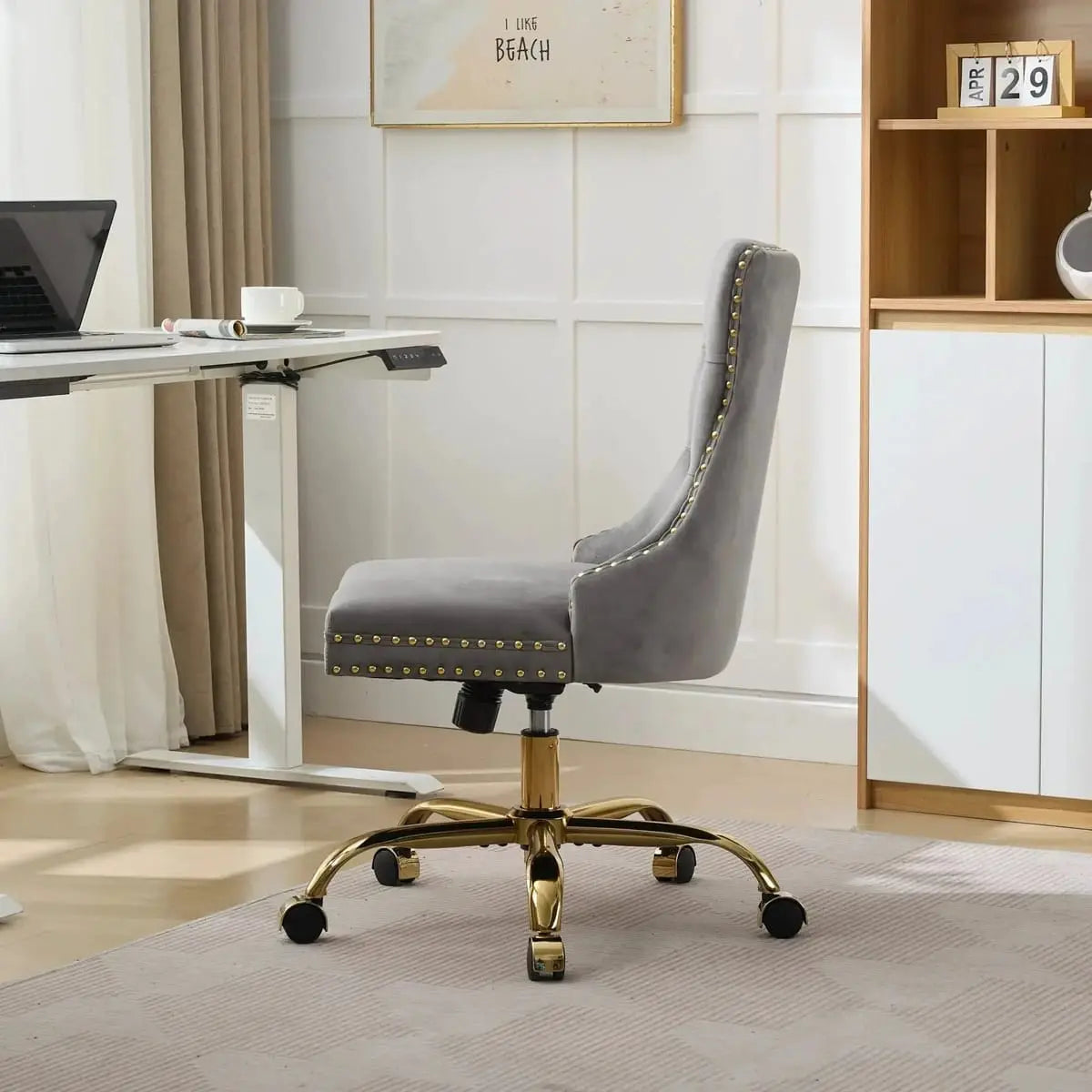 Luxurious gray velvet tufted office chair with gold base, adjustable swivel, and wide deep seating, from Platinum-Level Office Chairs.