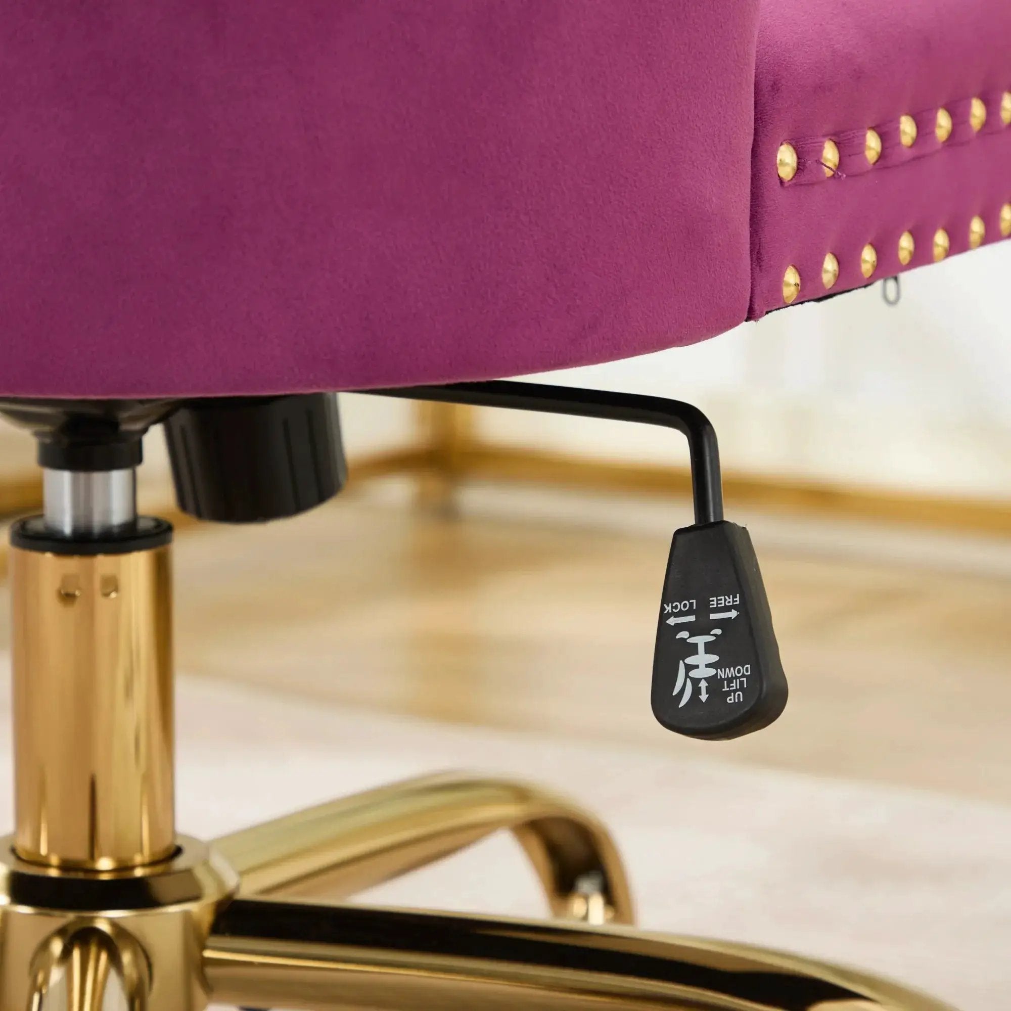 Luxurious purple velvet tufted office chair with gold metal base, nailhead trim, and deep wide seat by Platinum-Level Office Chairs.