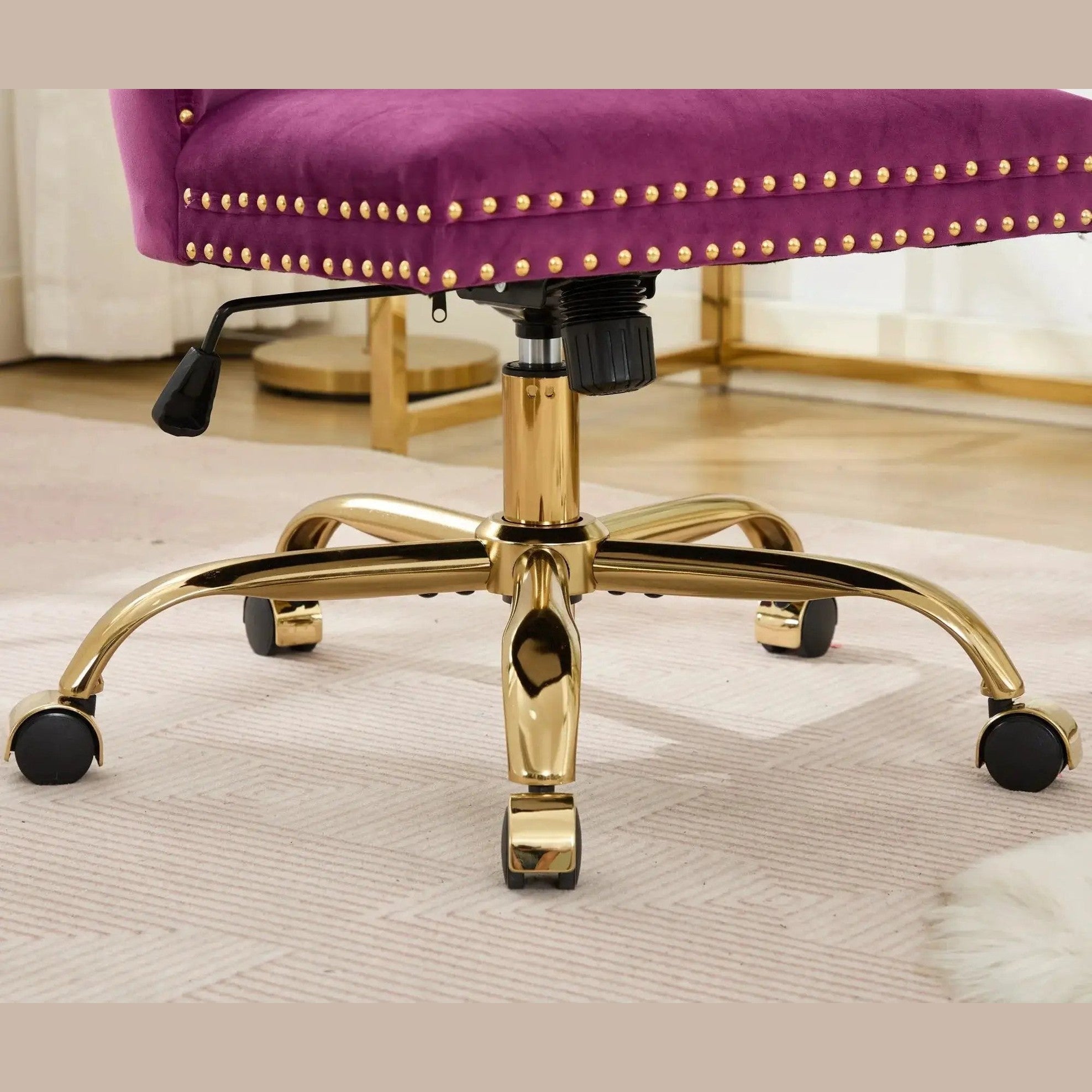 Luxurious purple velvet tufted office chair by Platinum-Level Office Chairs with gold metal base, nailhead trim, and deep wide seat.