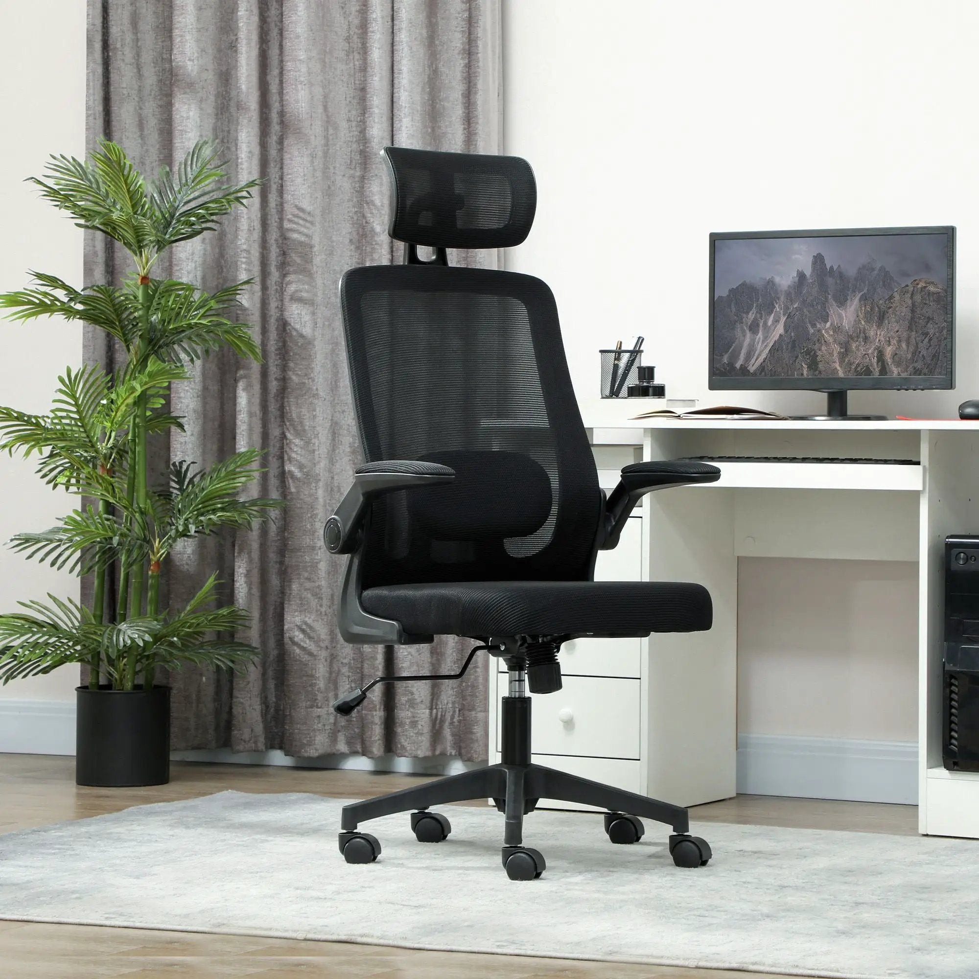 Black ergonomic mesh office chair by Platinum-Level Office Chairs with adjustable lumbar support and headrest for comfort.