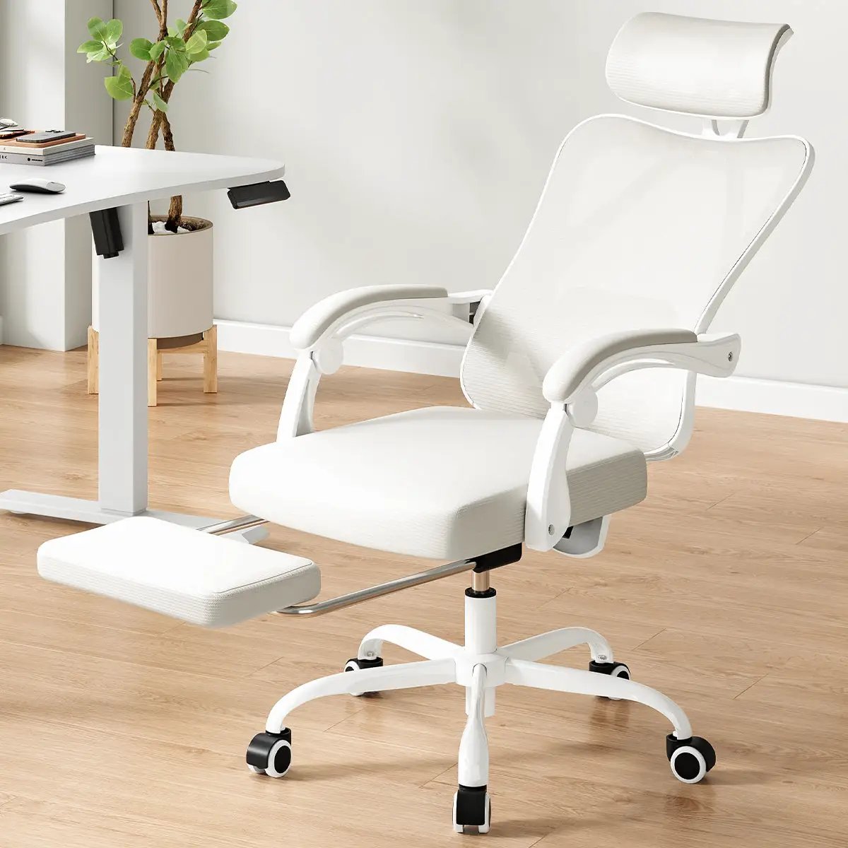 White ergonomic office chair with footrest and headrest by Platinum-Level Office Chairs, featuring mesh design for comfort.