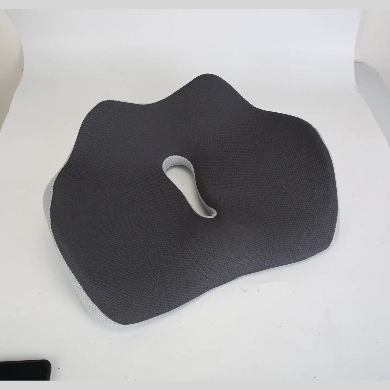 Grey ergonomic memory foam seat cushion by Platinum-Level Office Chairs, designed for office workers' comfort and support.