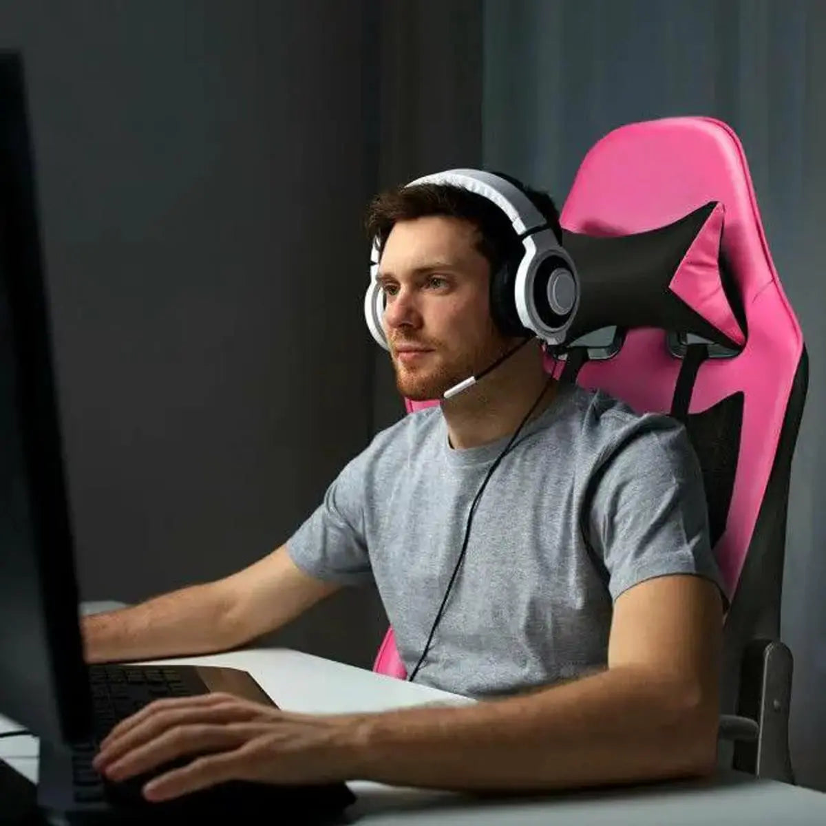 Pink ergonomic PU leather gaming chair with USB massage, designed for comfort and support by Platinum-Level Office Chairs.