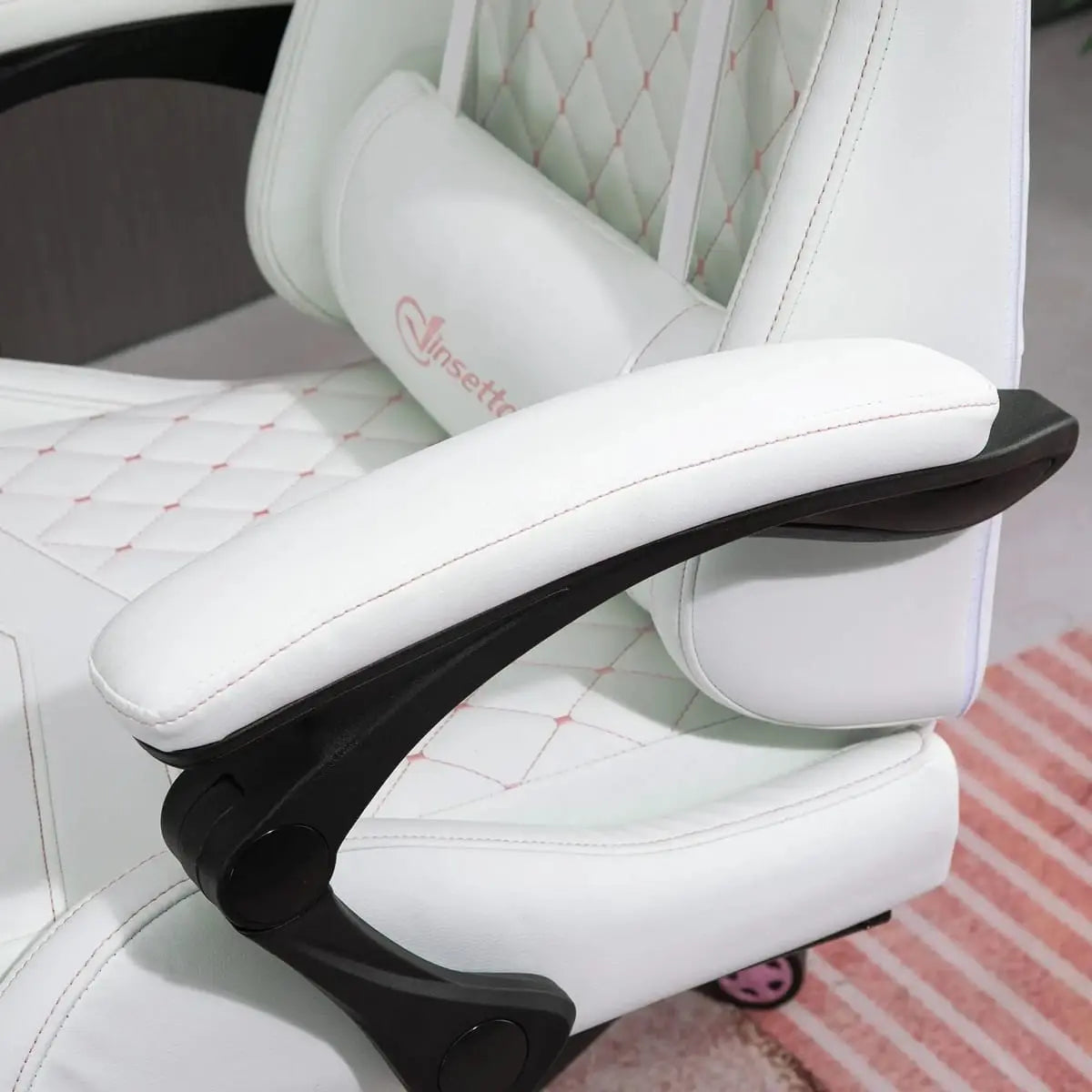 White ergonomic PU leather gaming chair with retractable footrest, high back, adjustable height, designed for work and play.