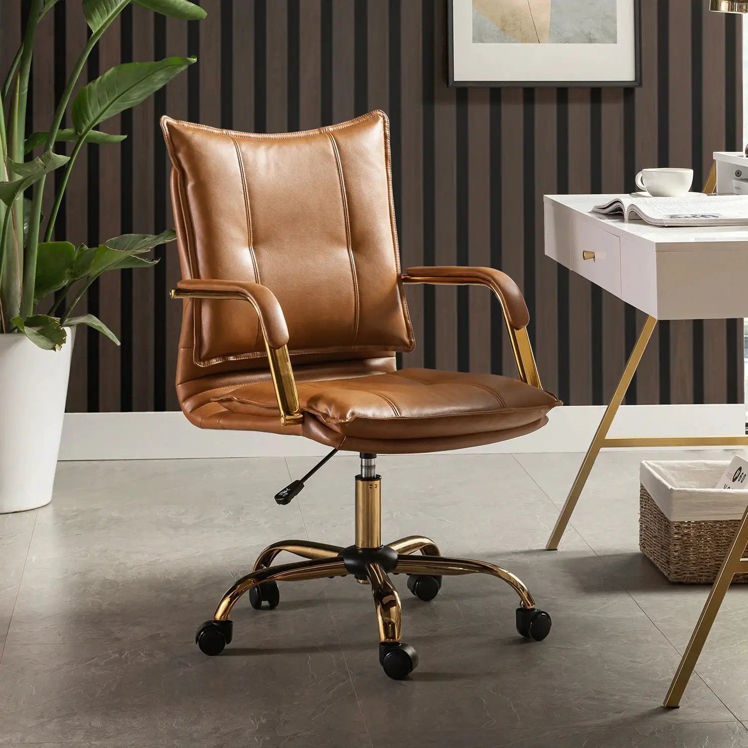 Modern black faux leather office chair by Platinum-Level Office Chairs with gold base, ergonomic swivel, and adjustable height for professionals.