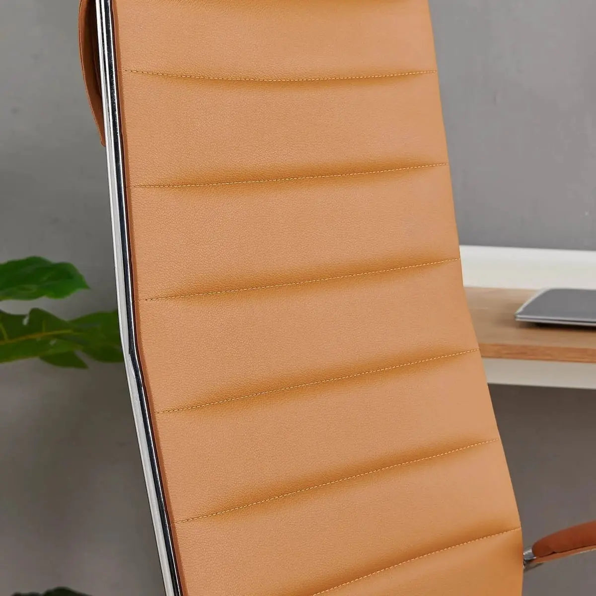 Modern orange faux leather home office chair by Platinum-Level Office Chairs, ergonomic design with adjustable features.