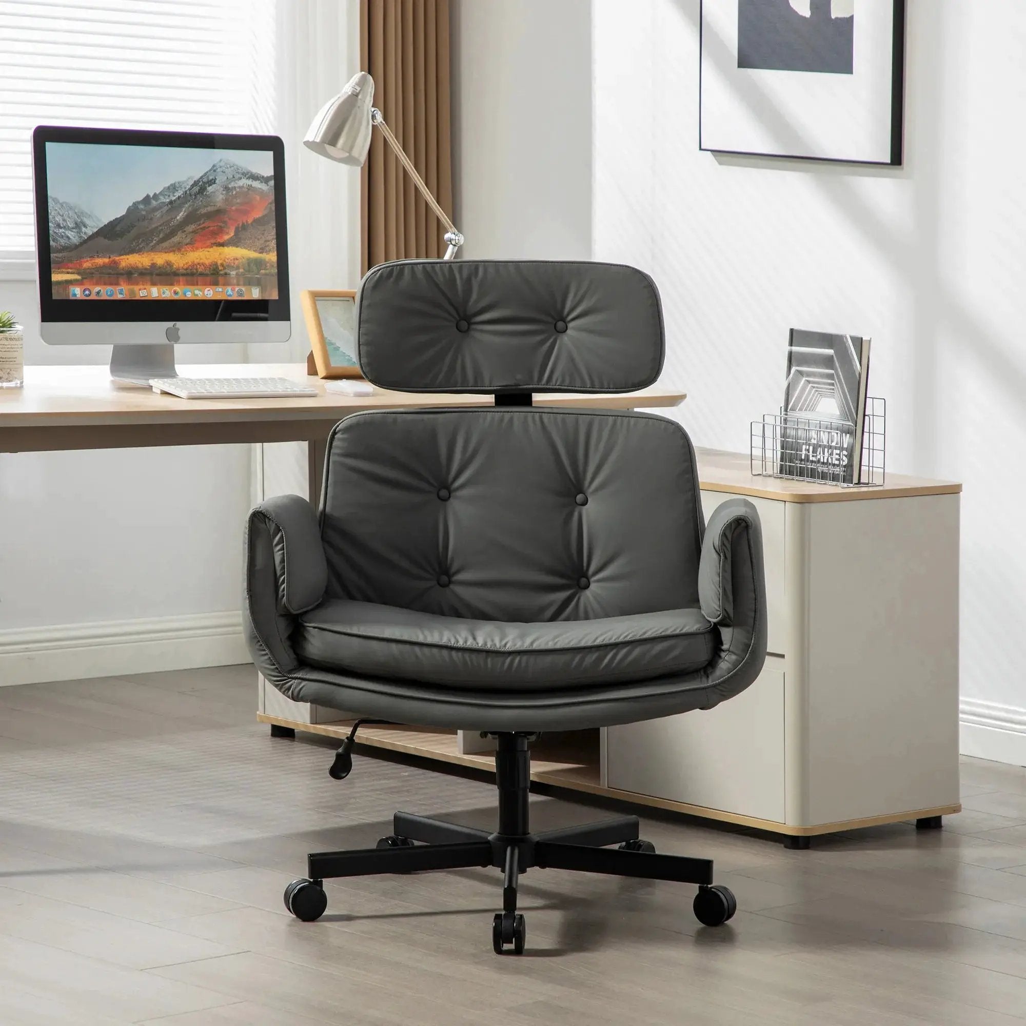Modern platinum-level office chair with criss-cross PU upholstery, adjustable armrests, and wheels for versatile seating comfort.