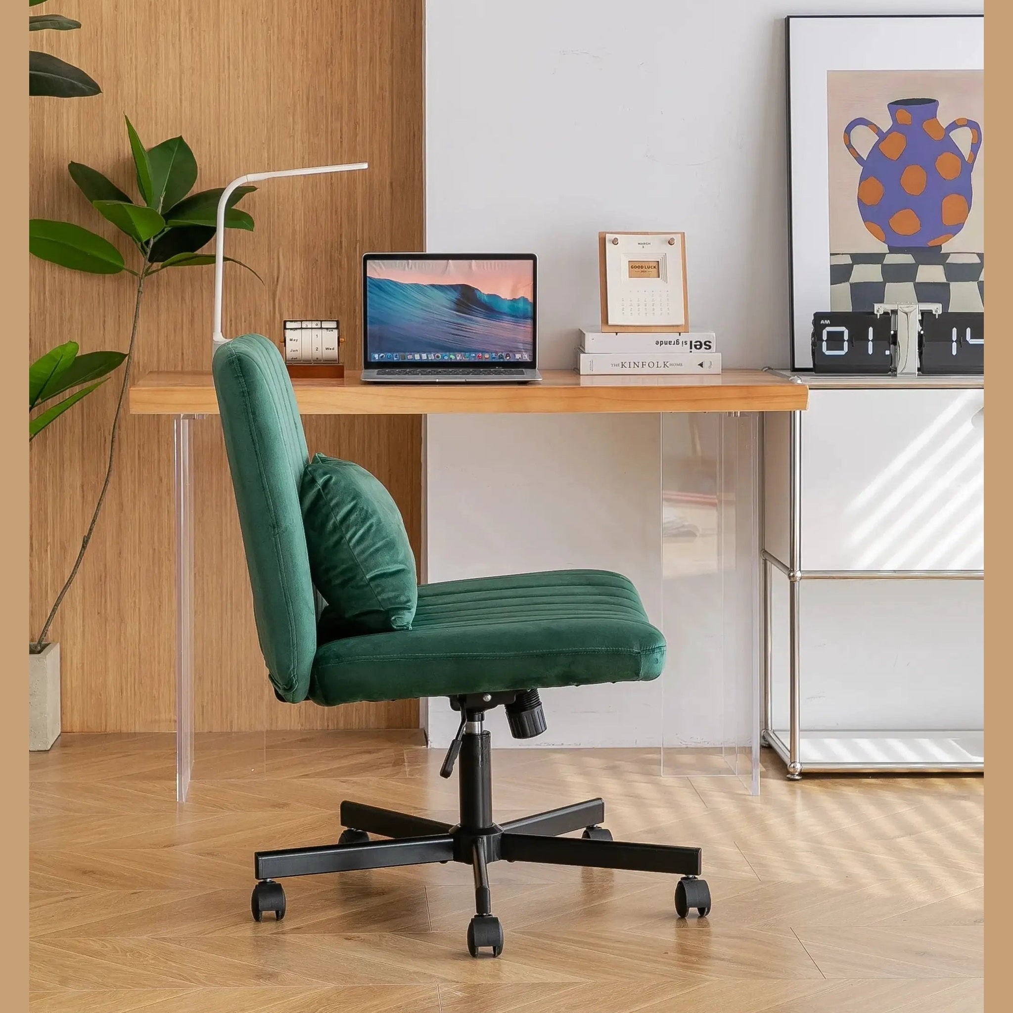 Green velvet armless office chair with criss-cross design, wheels, and ergonomic support by Platinum-Level Office Chairs.